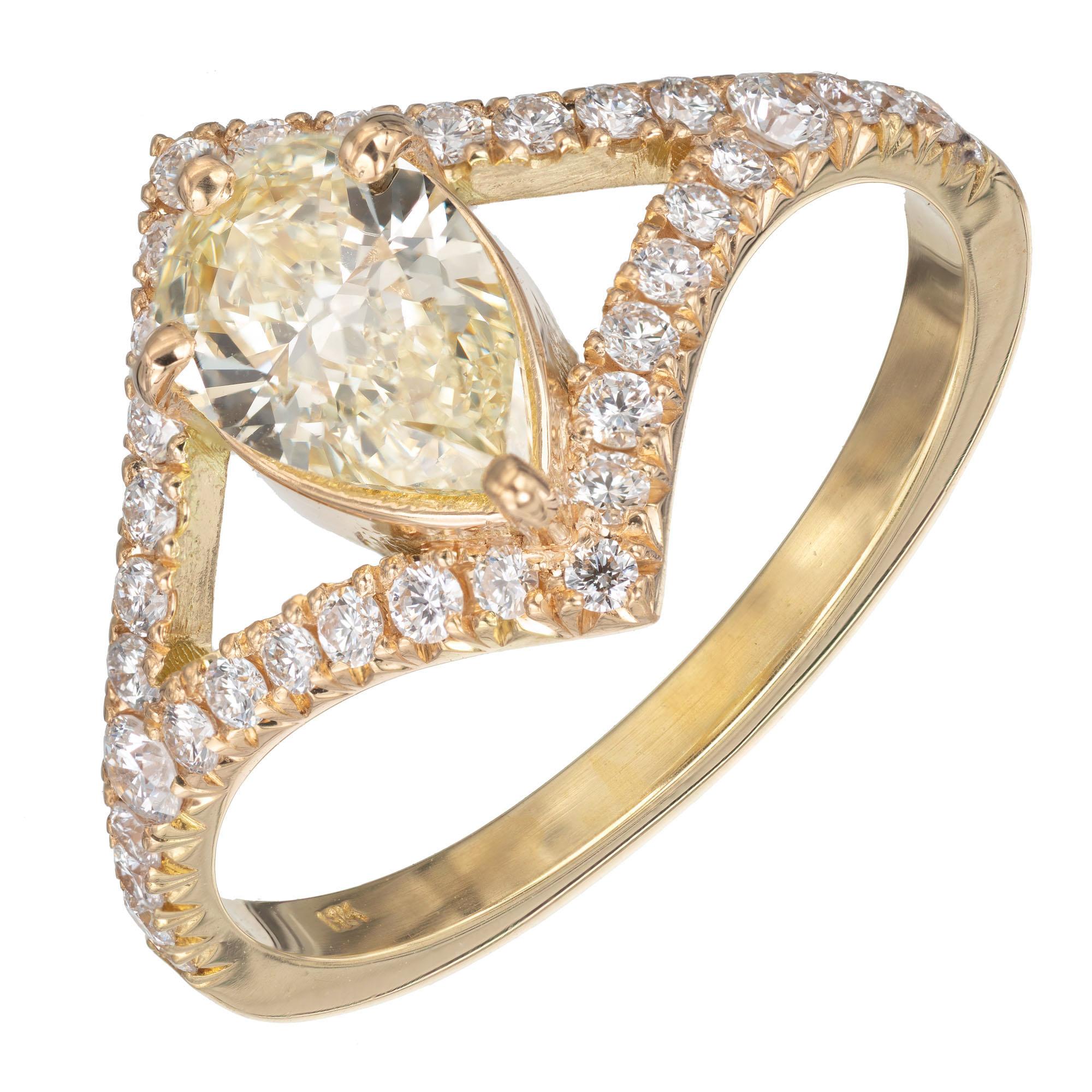 GIA certified. .70 carat pear-shaped light-yellow diamond in a micro pave white diamond 18k yellow gold setting. Crafted in the Peter Suchy Workshop.

1 pear brilliant cut light yellow diamond Y-Z VVS2, approx. .70cts Certificate # 620422386
36
