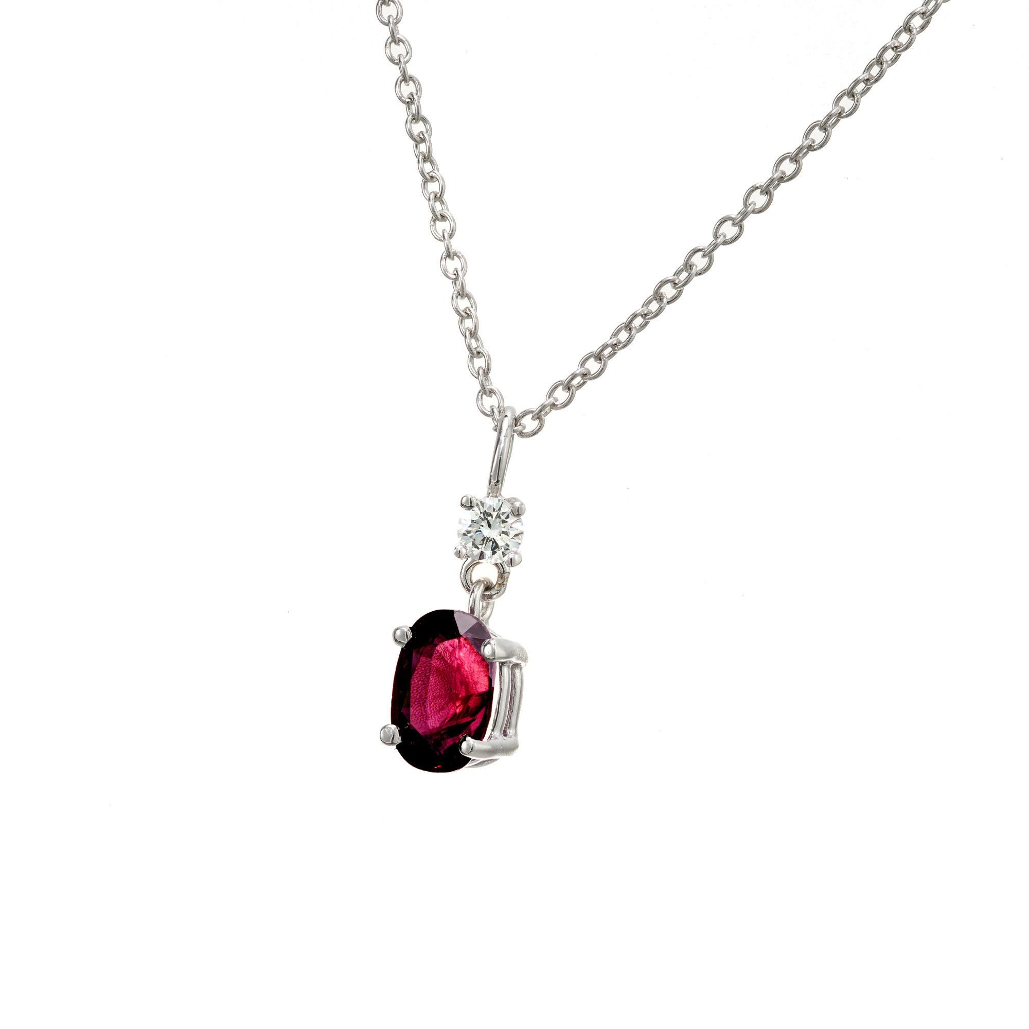 Ruby and diamond pendant necklace. GIA certified .76ct oval purple/ red ruby with 1 round accent diamond, set in a 14k white gold setting. 16 inch gold chain. The ruby is natural, simple heat only.  Designed and crafted in the Peter Suchy