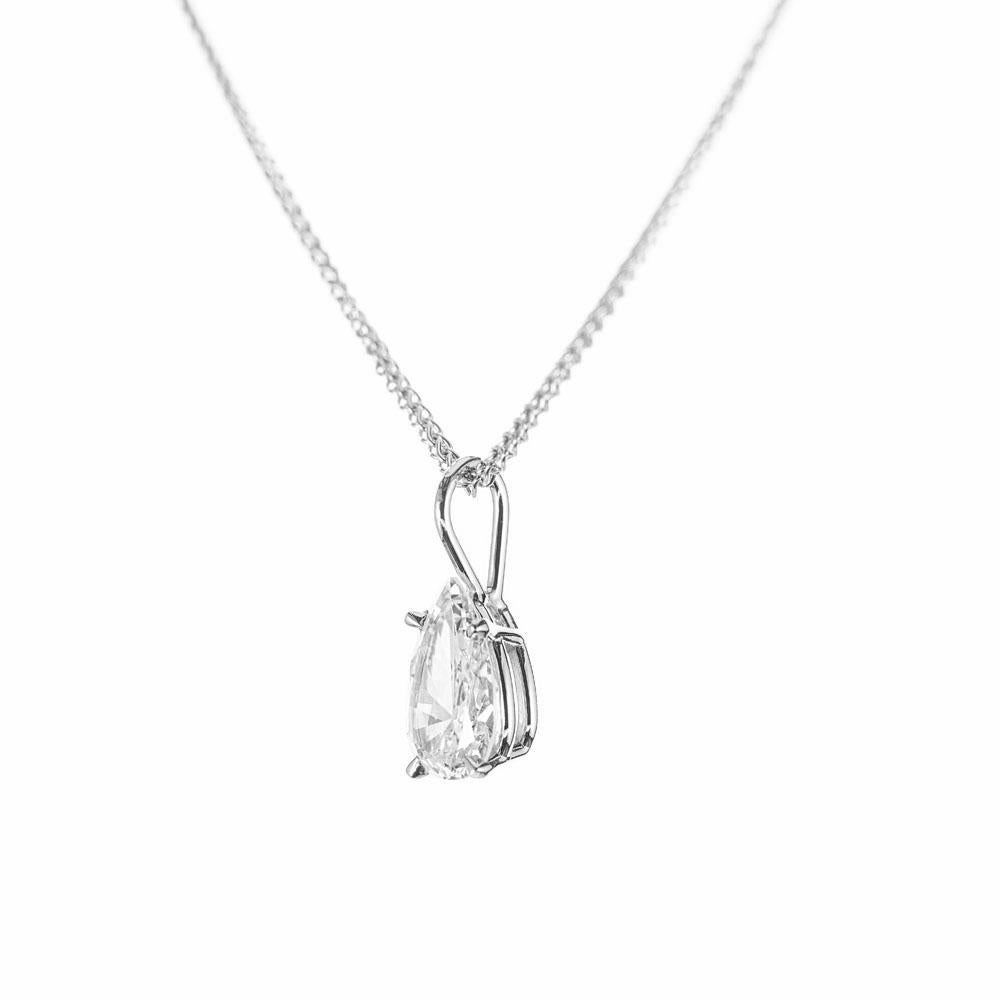 Pear shape diamond pendant necklace. GIA certified colorless F pear shape diamond, set in a 14k white gold basket setting. 15 inch, 14k white gold chain. Designed and crafted in the Peter Suchy workshop

1 pear shape diamond, F SI approx. .79cts GIA
