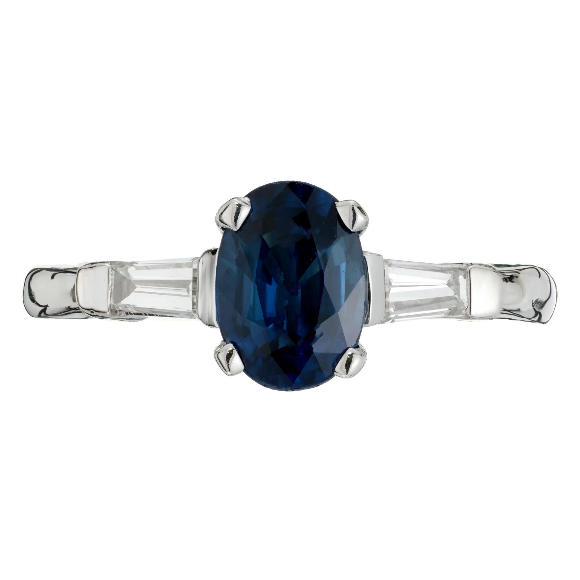 Sapphire and diamond three-stone engagement ring. GIA certified natural, no heat oval sapphire center stone with 2 tapered baguette side diamonds. Set in a 14k white gold setting. Designed and crafted in the Peter Suchy workshop

1 oval blue