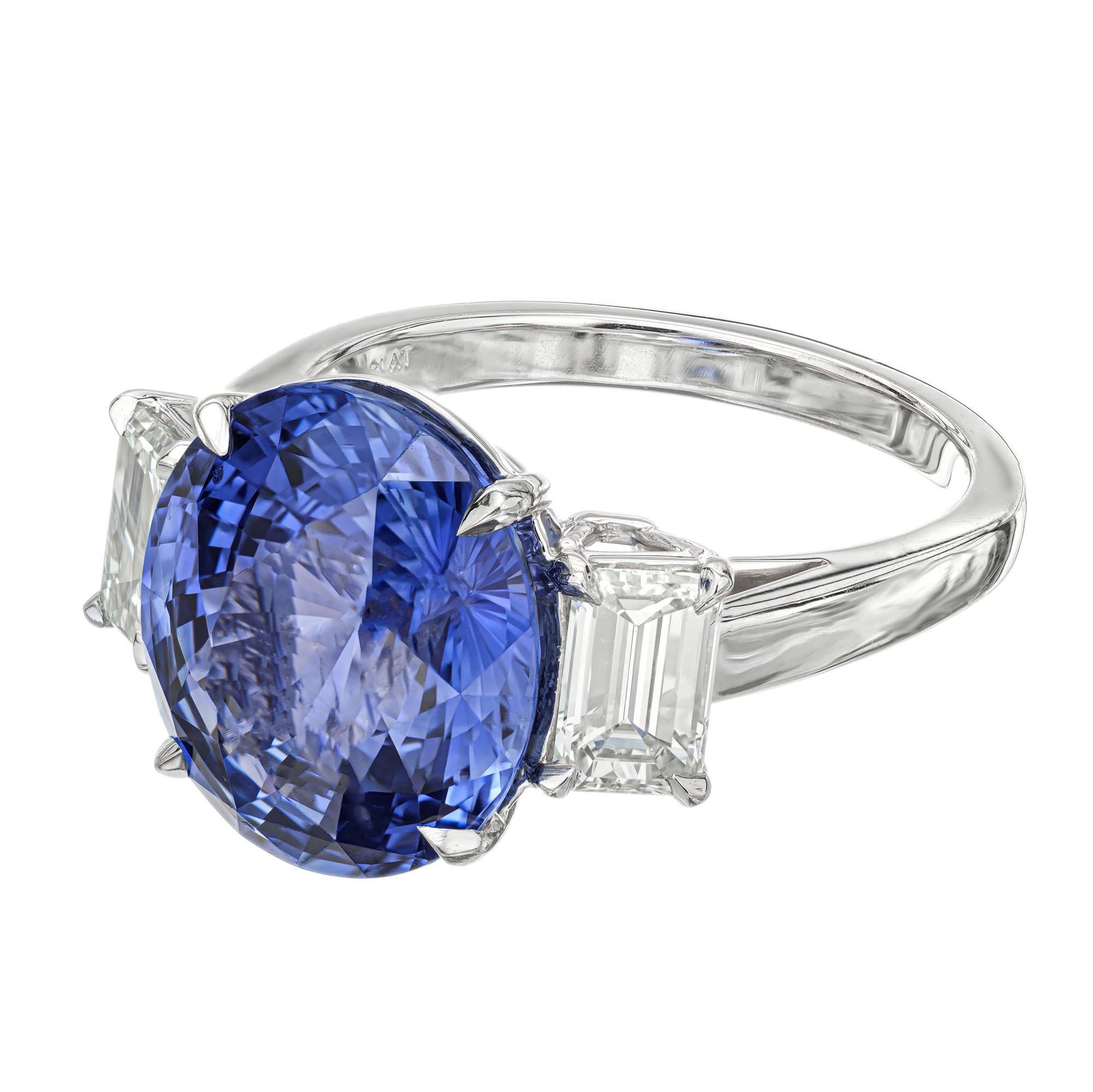 Sapphire and diamond three-stone engagement ring. GIA certified 8.16 carat oval sapphire in a platinum setting with 2 emerald cut side diamonds totaling 1.09cts. Designed and crafted in the Peter Suchy Workshop.

1 oval bright blue sapphire, VS