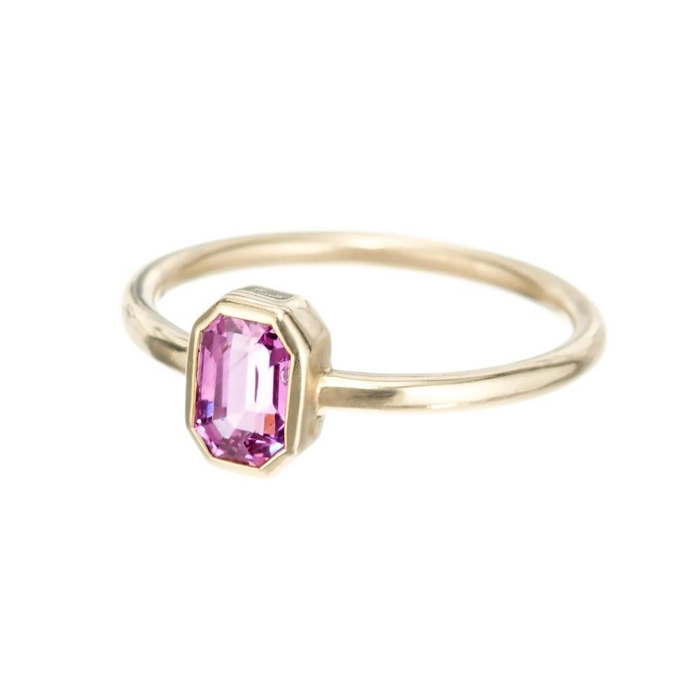 Pink sapphire engagement sapphire. GIA certified octagonal natural pink bezel set sapphire center stone in a 14k yellow gold solitaire setting. Designed and crafted in the Peter Suchy Workshop for the person looking for uniquely different engagement