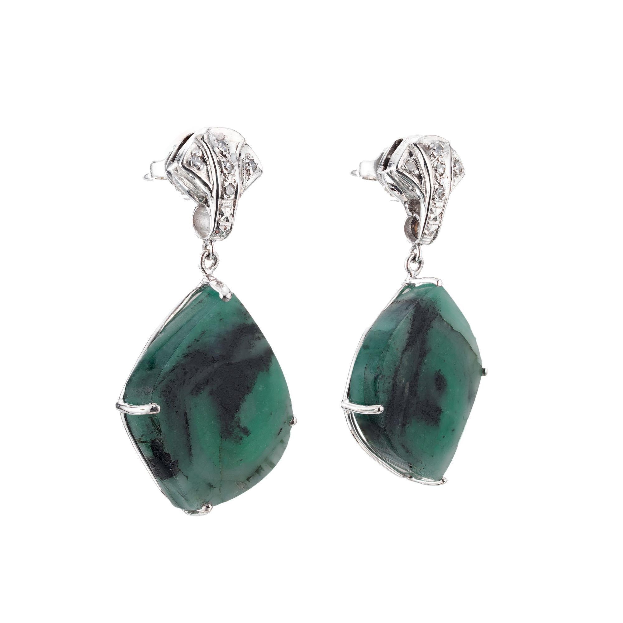 Vintage Inspired natural untreated Emerald tablet slices in simple Platinum settings with 10 single cut accent diamonds. Created in the Peter Suchy Workshop.  

2 freeform green Emerald tablets, approx. total weight 8.50cts, GIA certificate