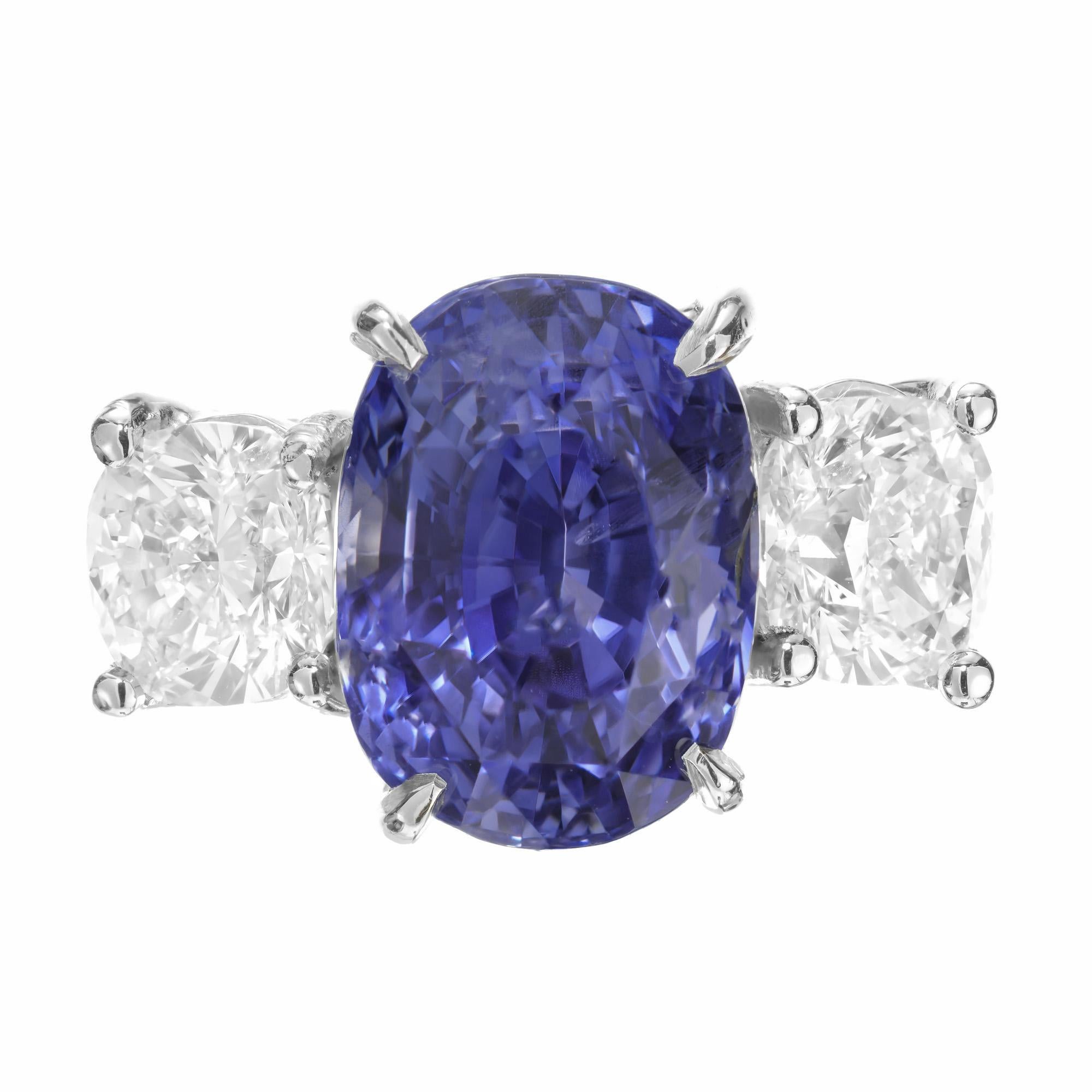 Natural cushion cornflower blue Sapphire an diamond engagement ring. GIA certified cushion cut oval sapphire center stone. Certified as no heat, no enhancements. Platinum three-stone setting with two round GIA certified cushion brilliant cut side