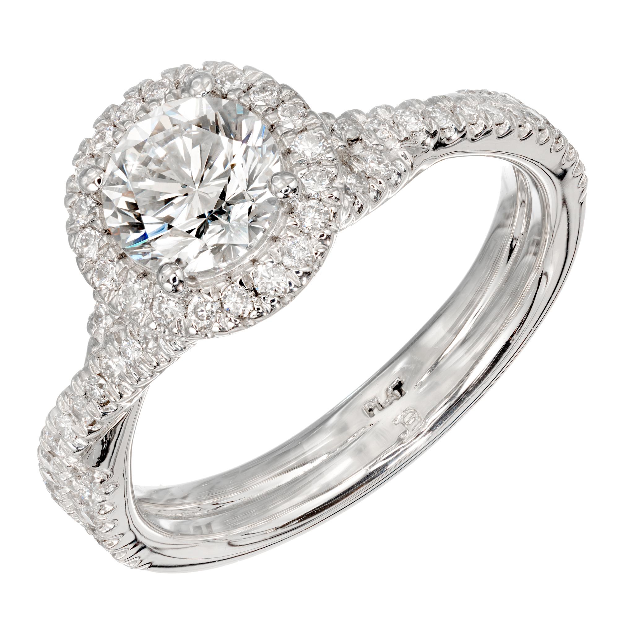 Crisscross style diamond halo engagement ring. Set with a bright sparkly transitional cut center diamond, from a 1940's estate. The platinum halo setting  has a crisscross micro pave diamond shank that allows a wedding band to sit flush against it.