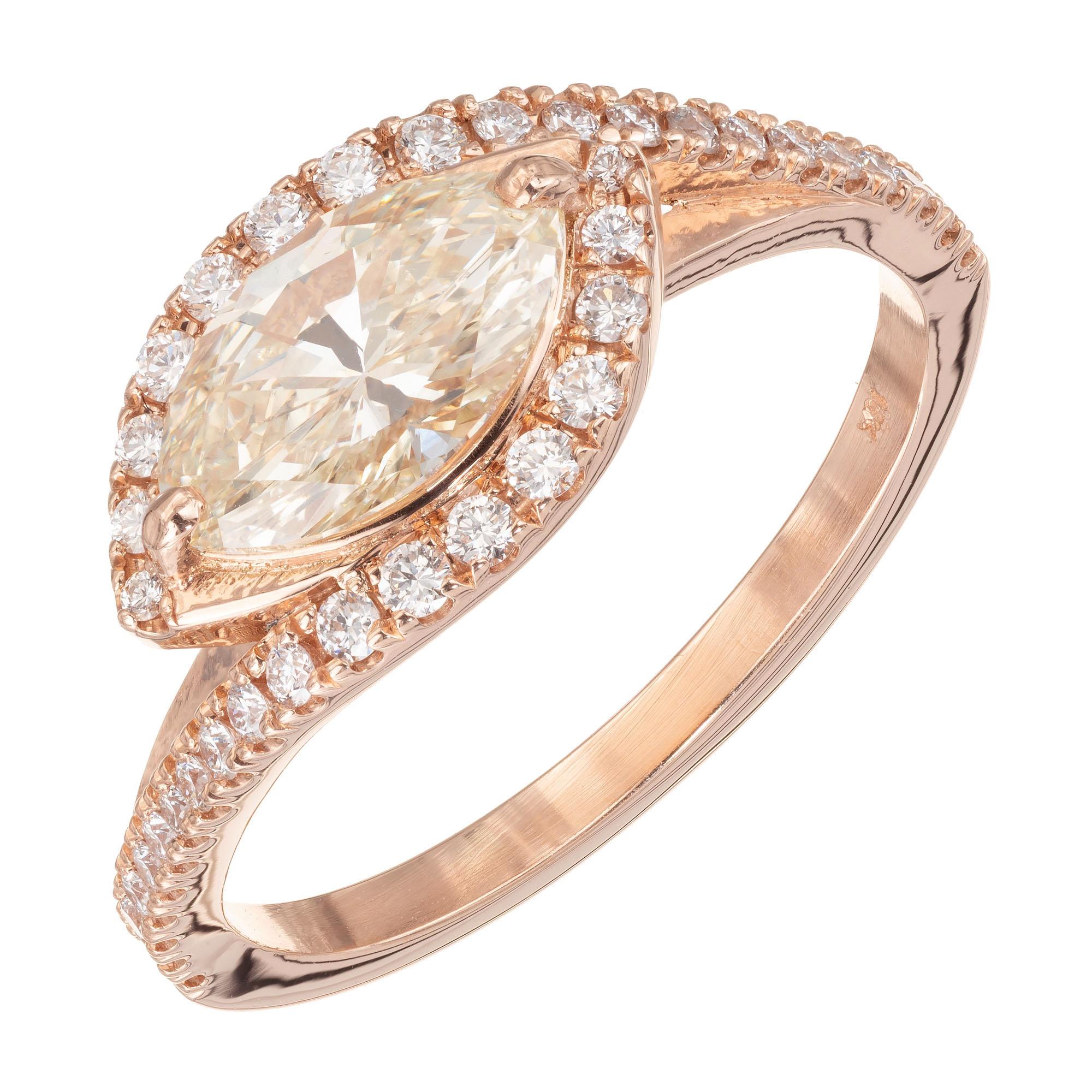 Marquis diamond halo engagement ring.  circa 1950 GIA certified soft warm yellow center stone in a 18k rose gold Swirl bypass micro pave diamond setting. 

1 marquis brilliant cut diamond W-X SI2, approx. .98ct GIA Certificate # 6204224361
38 round