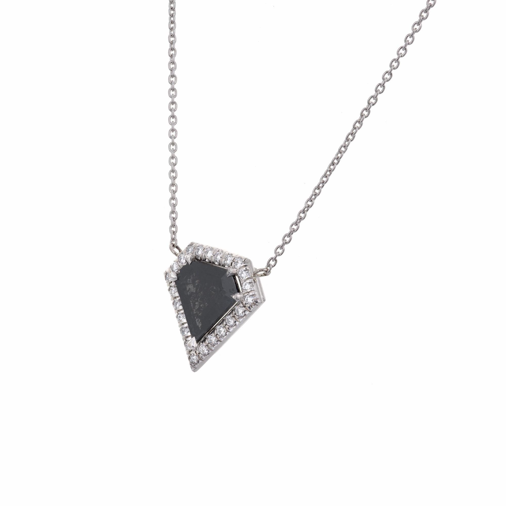 Diamond shape natural black diamond halo pendant. GIA certified as natural black fancy color with even color distribution. The pendant was designed and crafted in the Peter Suchy workshop

1 natural fancy black diamond, I natural salt and pepper