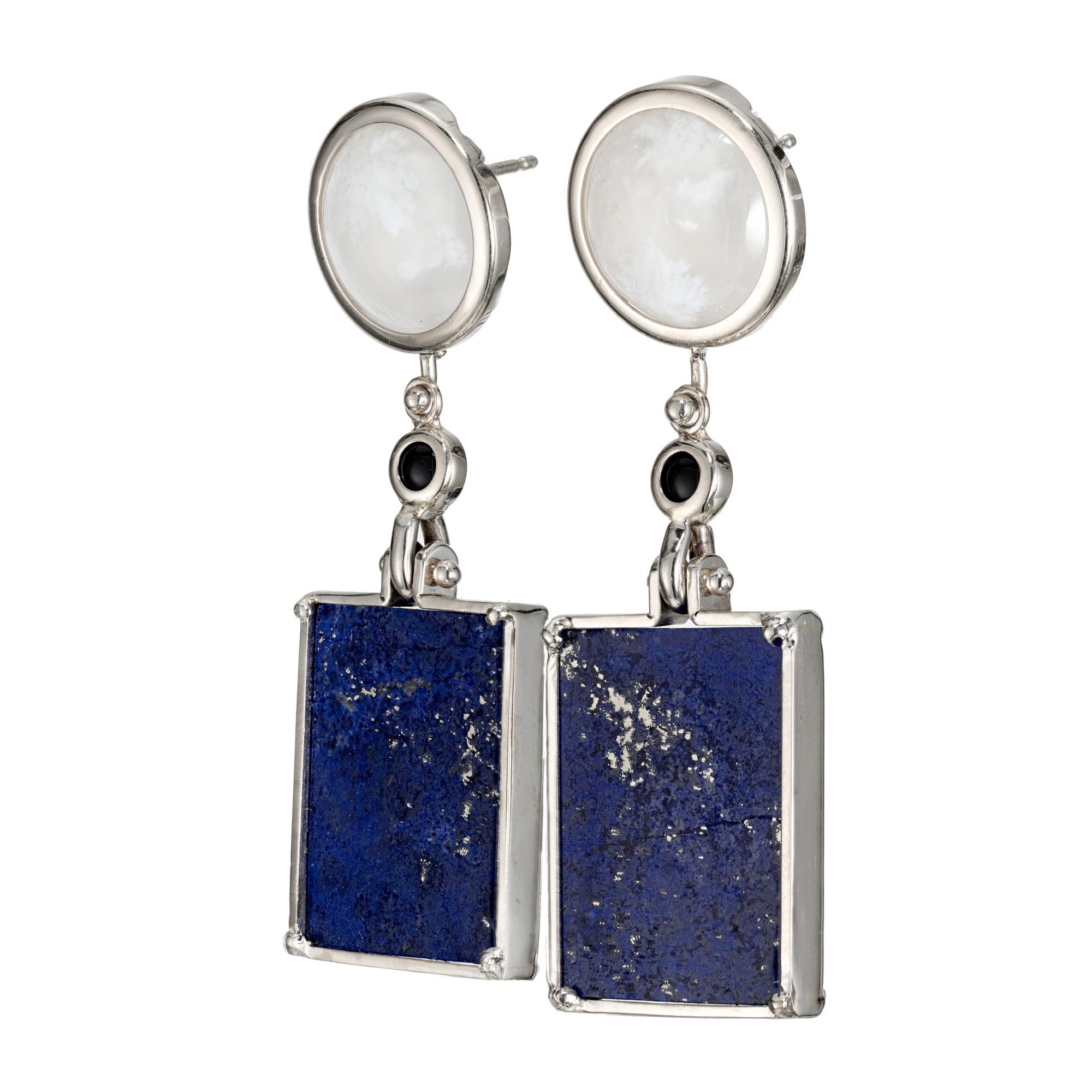 Agate, onyx and Lapis dangle earrings. 2 rectangle slices of lapis in 14k white gold frames with 2 round cabochon onyx and 2 round cabochon lace agate bezel set accent stones. Custom made pair of 14k white gold dangle earrings from the Peter Suchy