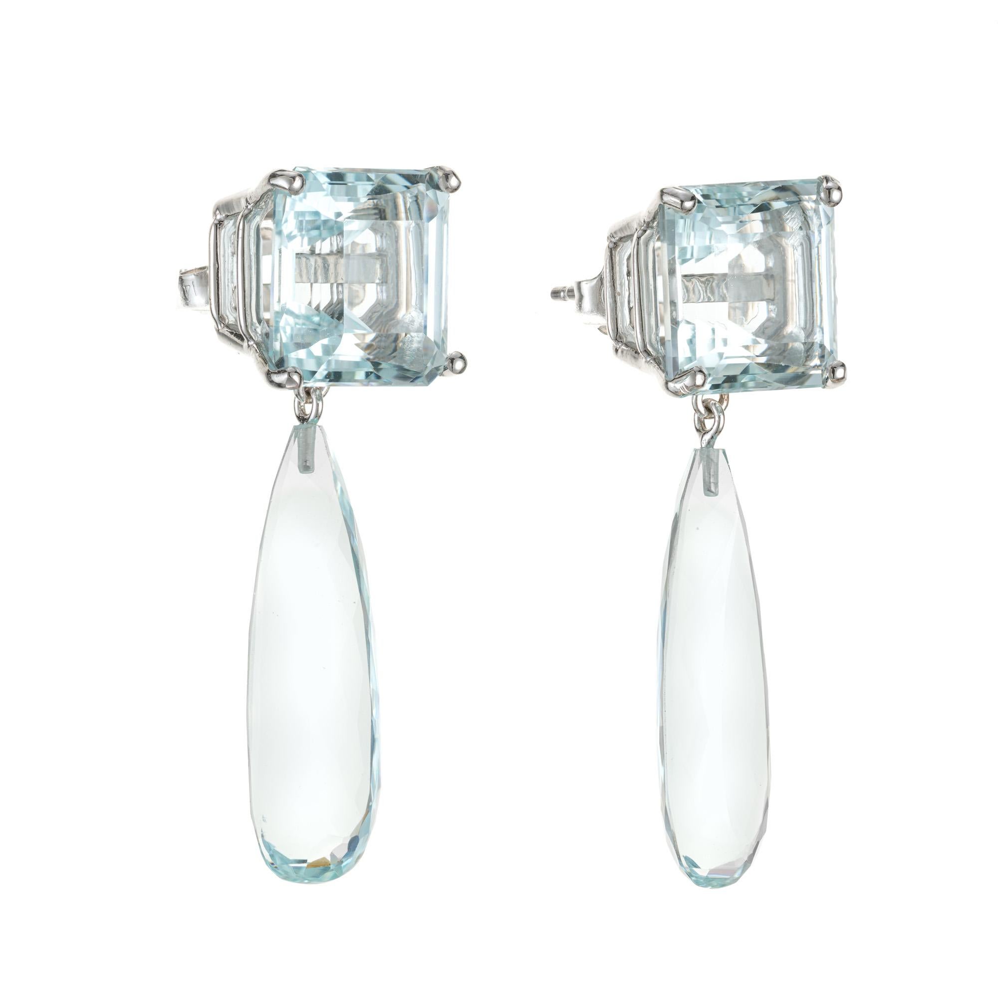 Natural light blue untreated Aqua dangle earrings. 2 square cut aquamarines totaling 13.82cts with 2 briolette pear shaped aqua dangles in 14k white gold settings. Created in the Peter Suchy workshop. 

2 square Aquamarine, approx. total weight