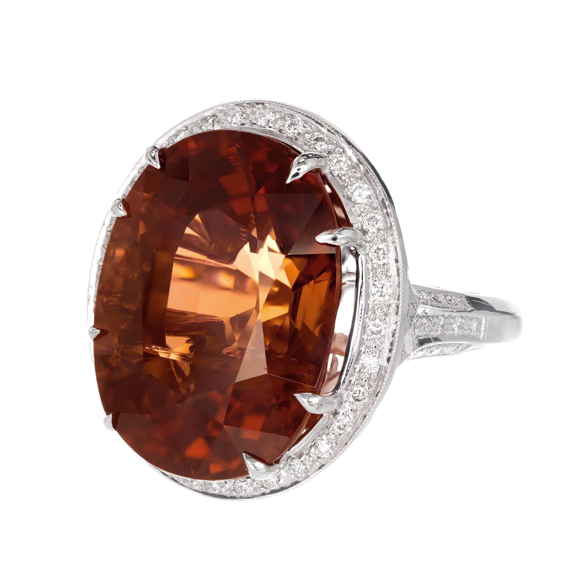 Peter Suchy natural untreated large oval 26.79ct Tourmaline and diamond cocktail ring. 18k white gold setting with a diamond halo.  GIA certified as natural. The stone is a true bi-color with pinkish brown towards both ends and brown in the middle.