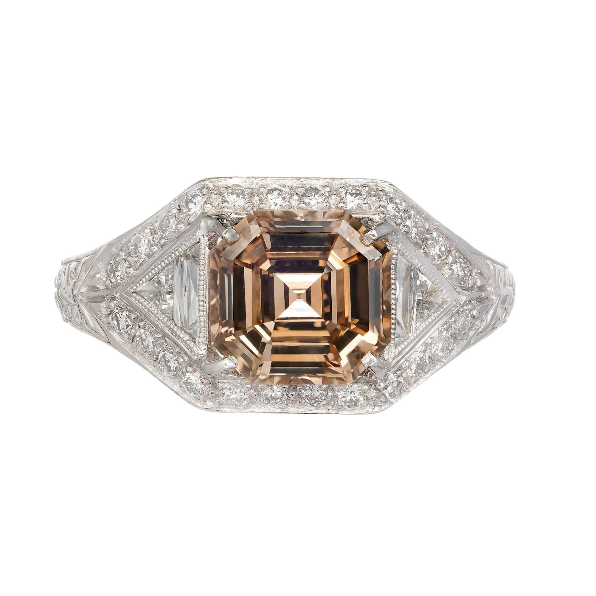 Natural 2.00ct Asscher cut diamond yellow brown color engagement ring, in a platinum setting surrounded by calibre diamonds. Setting designed by the Peter Suchy Workshop

1 original Asscher step cut fancy yellow brown diamond, approx. total weight
