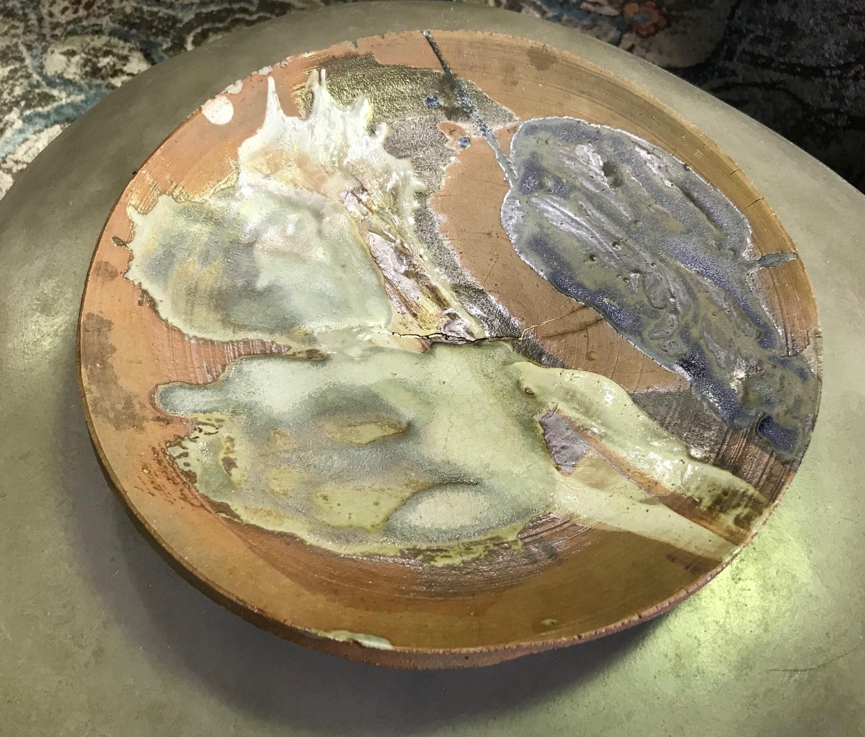 A fantastic, freeform, large, heavy plate/ charger by American master potter Peter Voulkos who is known for his abstract expressionist ceramic pottery pieces and sculptures. Very unique and scarce work with rare use of color. Very hard to come by.
