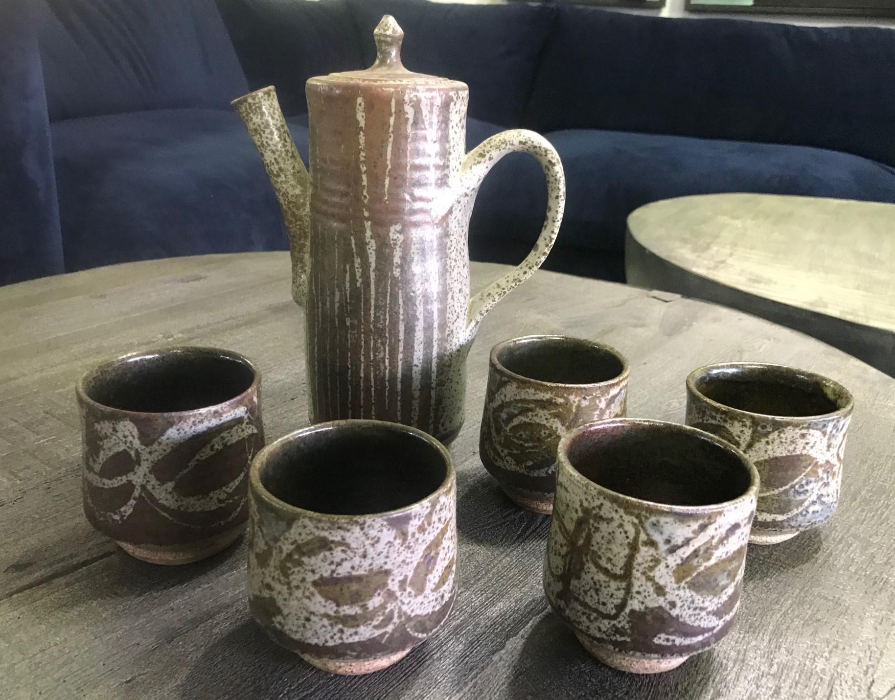 A fantastic, quite rare early tea/coffee set by American master potter Peter Voulkos who is known for his abstract Expressionist ceramic pottery pieces and sculptures. A very atypical piece. So finely thrown. The craftsmanship and design are