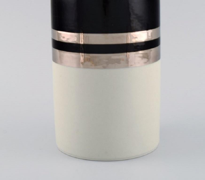 Finnish Peter Winquist for Arabia. Modernist vase in ceramics with silver decoration. For Sale