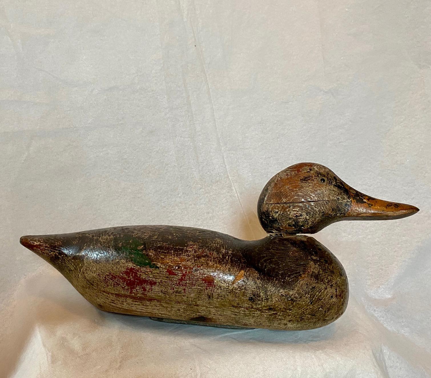 Early Peterson Mallard Hen Decoy, circa 1880, a proud and pioneer factory decoy with glass eyes, good worn original paint with possibly some old working touch-ups to the black on tail and shoulders, nice speckling on breast, very long bill and
