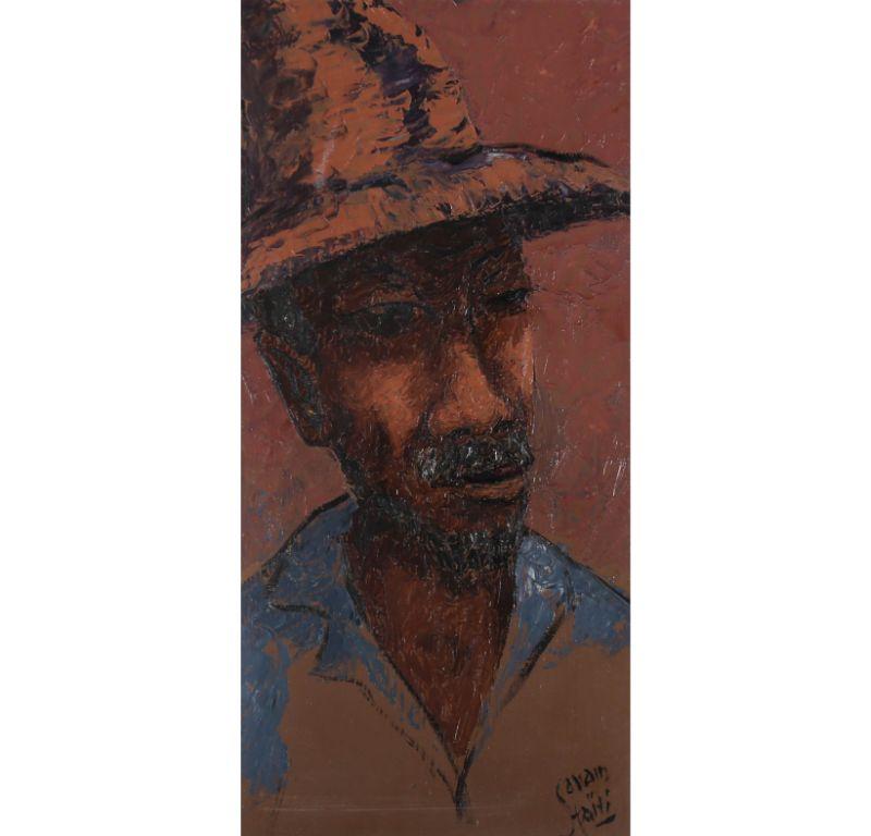 A charming depiction of a Haitian man wearing a hat. The artist captures his profile in expressive brushwork, creating a highly textures portrait. Signed to the lower right. Presented in a wooden frame. On board. 
