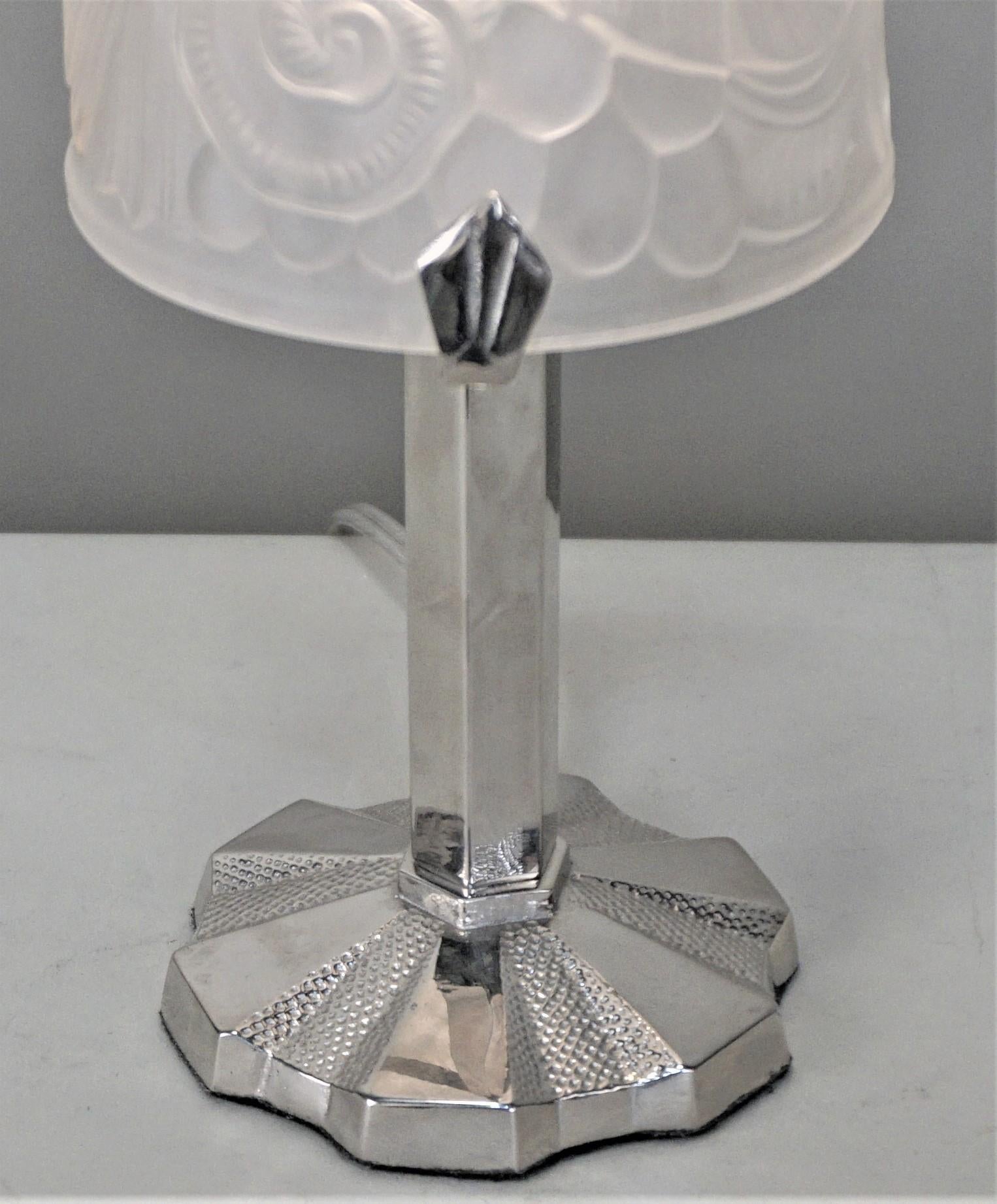 Clear frost French Art Deco table lamp with nickel on bronze base.