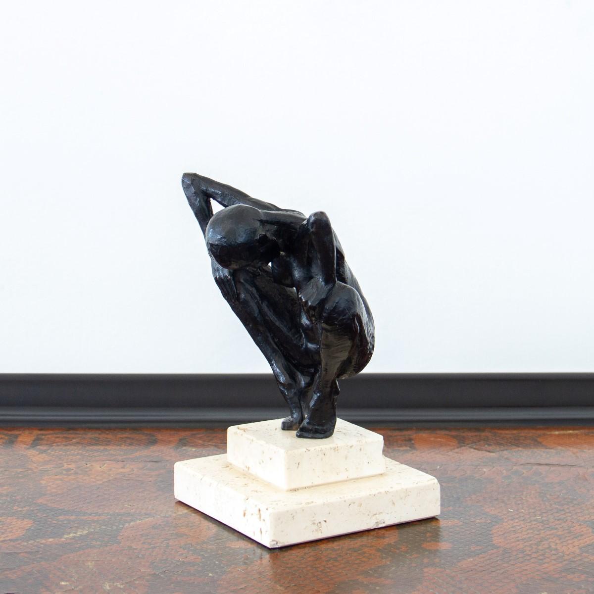 A crouching nude bronze figure on a stepped travertine base, titled 'Petit Accroupie' by French sculptor, Nicolas Lavarenne, 1991 artist addition, 4/4.

Nicolas Lavarenne is a largely self-taught sculptor from France. Lavarenne’s works can be