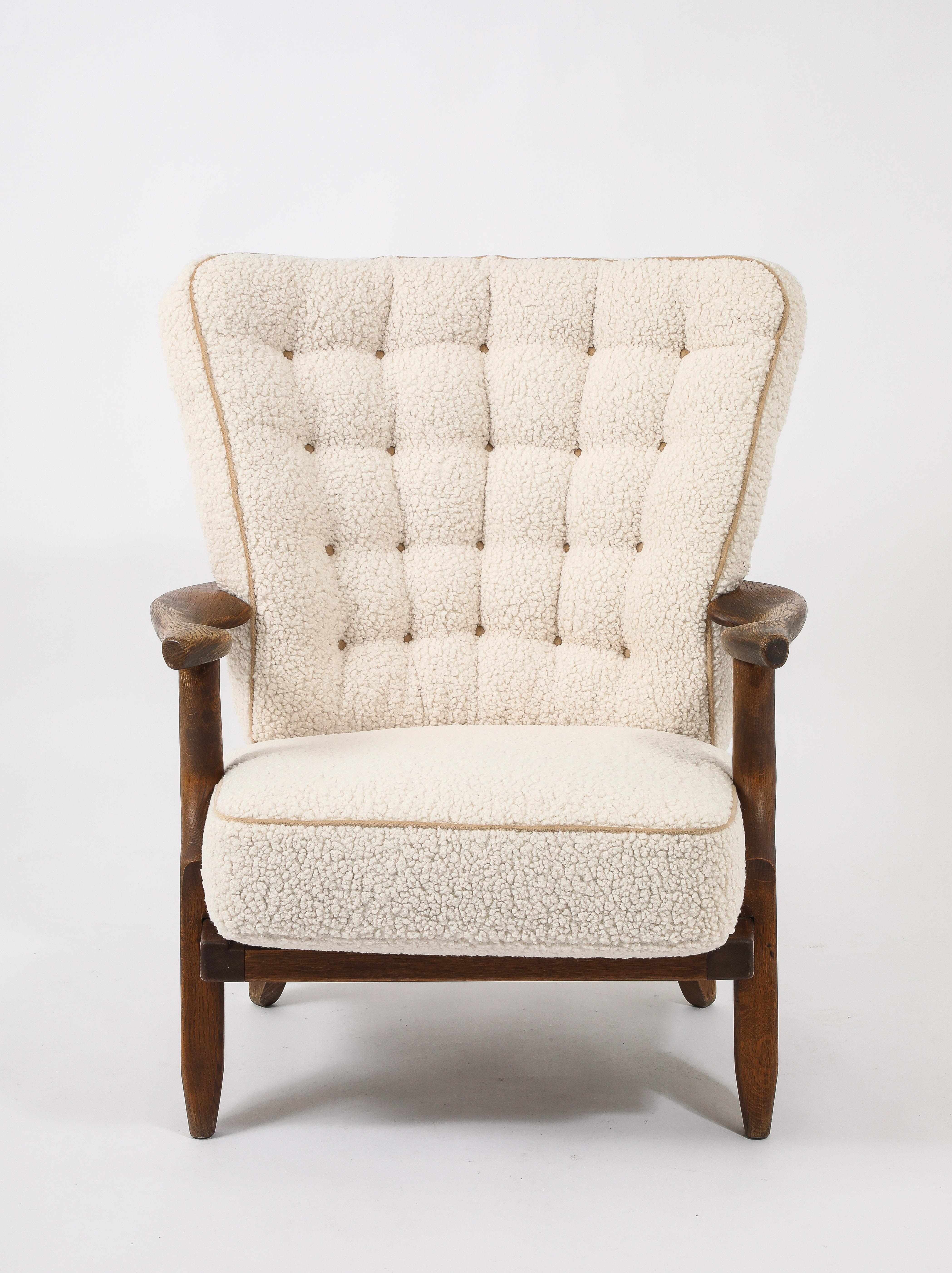 Classic petit confort armchair by G&C in oak in original finish and freshly reupholstered.

30x30x36
Seat height 15, Seat 20x22, Arm 22