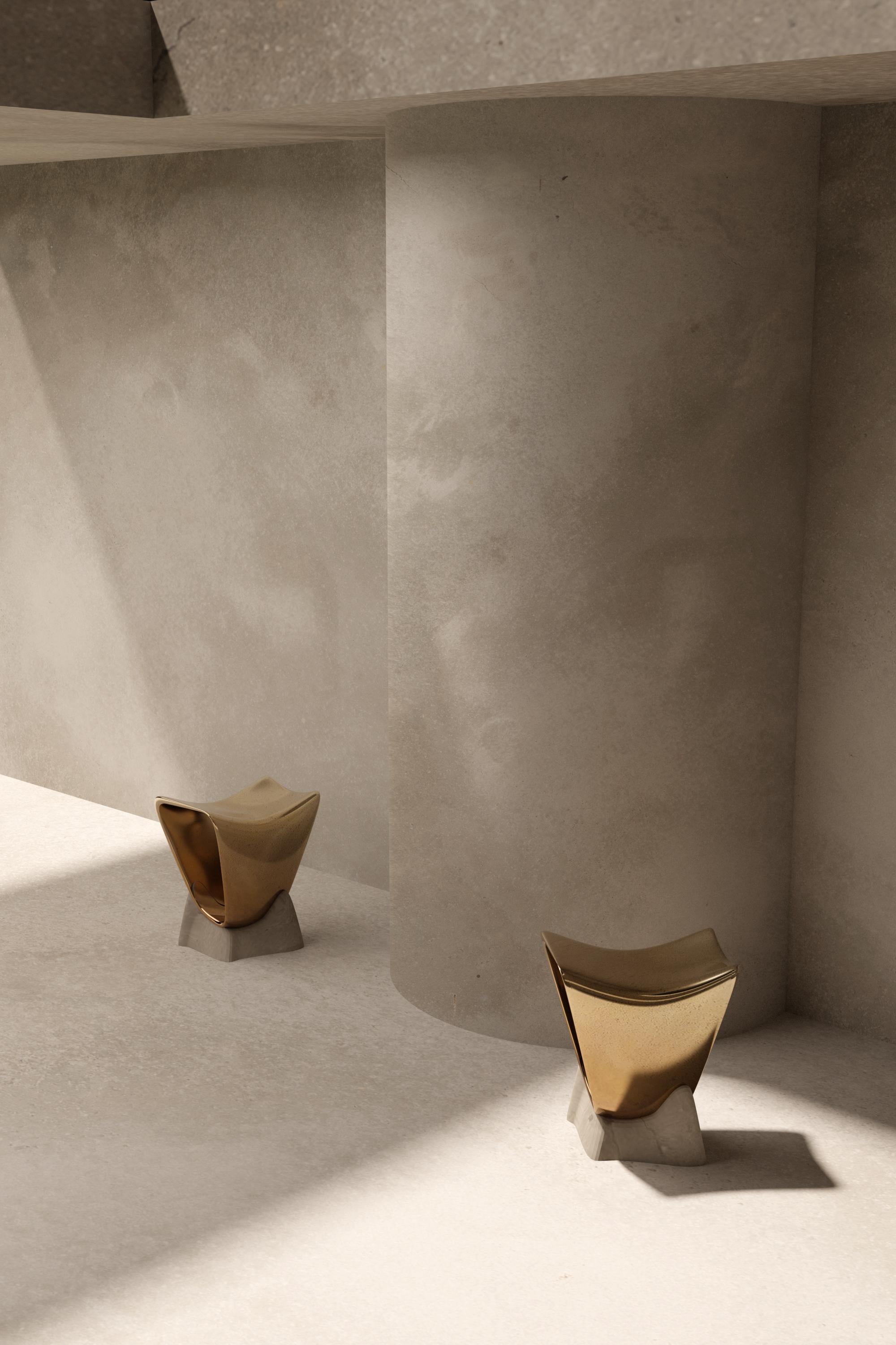 PETIT CREUX, 2020 - a little cast metal stool with a cold bronzed polished finish, the 
 stool sits upon a detachable hand smoothed limestone patina base. This decorative object is just as much a sculpture as it is a usable seating accent piece. 