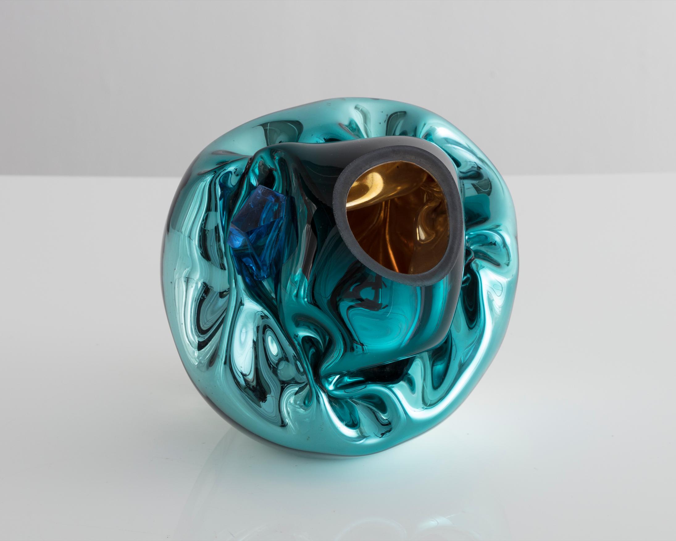 Unique petite crumpled sculptural vessel in silver and turquoise mirrorized hand blown glass with applied glass crystal. Designed and made by Jeff Zimmerman, USA, 2017.

Limited number available. Please note that each item may differ slightly in