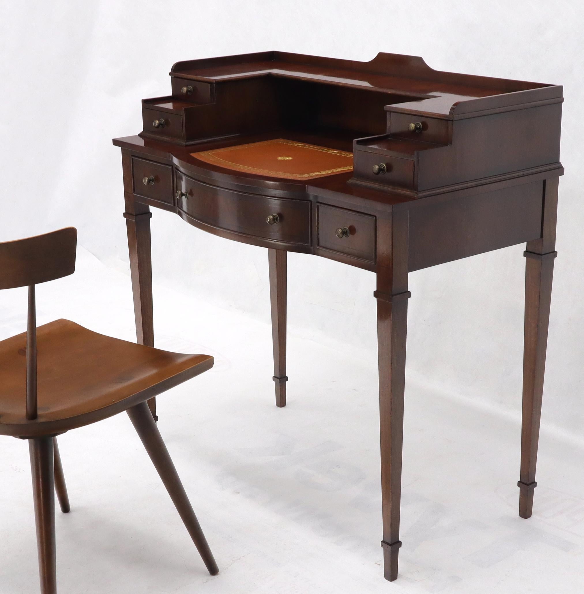 Beautiful English petit mahogany desk console entry lobby table with leather top.