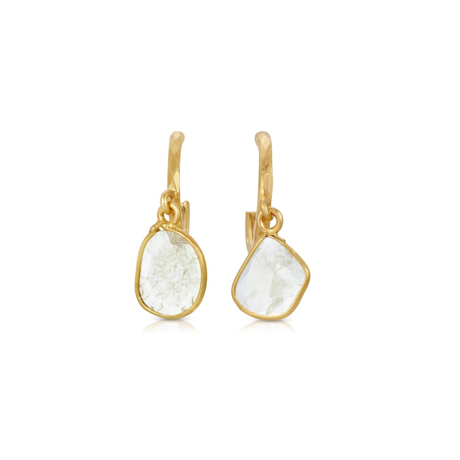 Petit hoops suspending naturally shaped opaque ice Diamond charms.

- Finely shaved White Diamond weight approx .50 Carats.
- Set in 18 Karat Gold.
- Drop approx 5 mm.
- For pierced ears on 18 Karat Gold stems and butterfly closure.