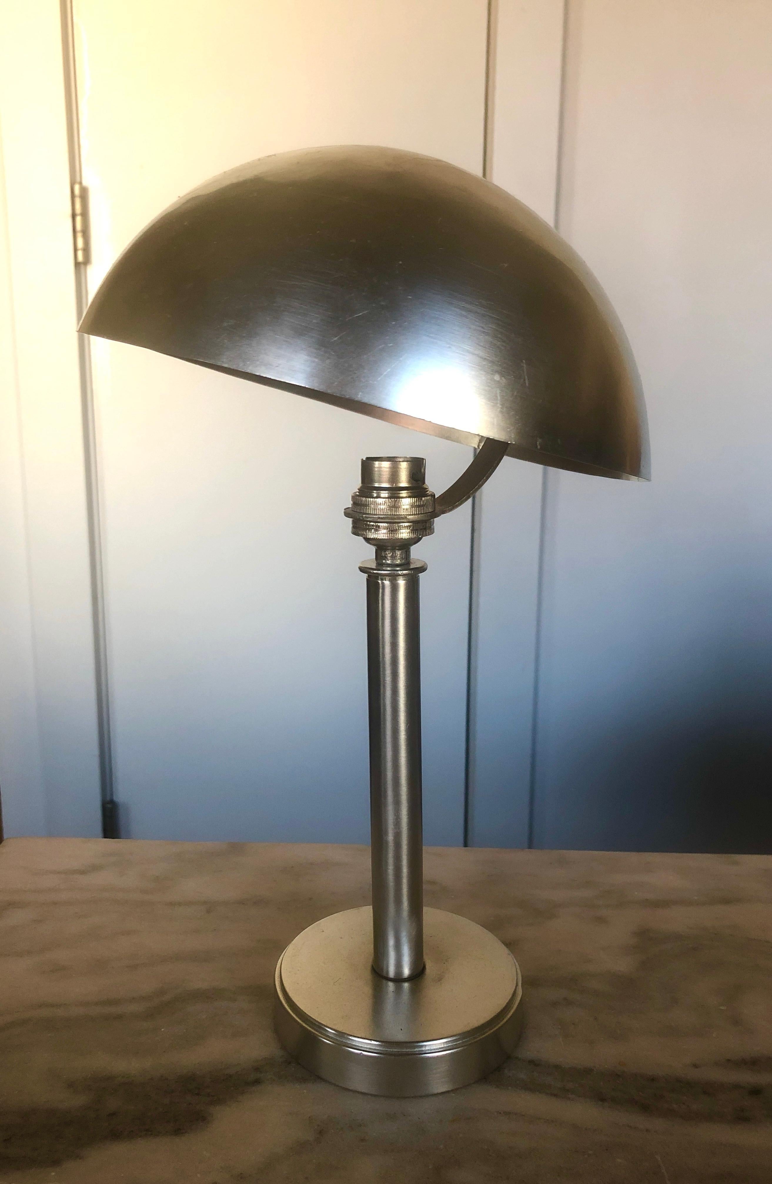 France, brushed nickeled surface over bronze with adjustable dome shade, circa 1930. Retains European socket.