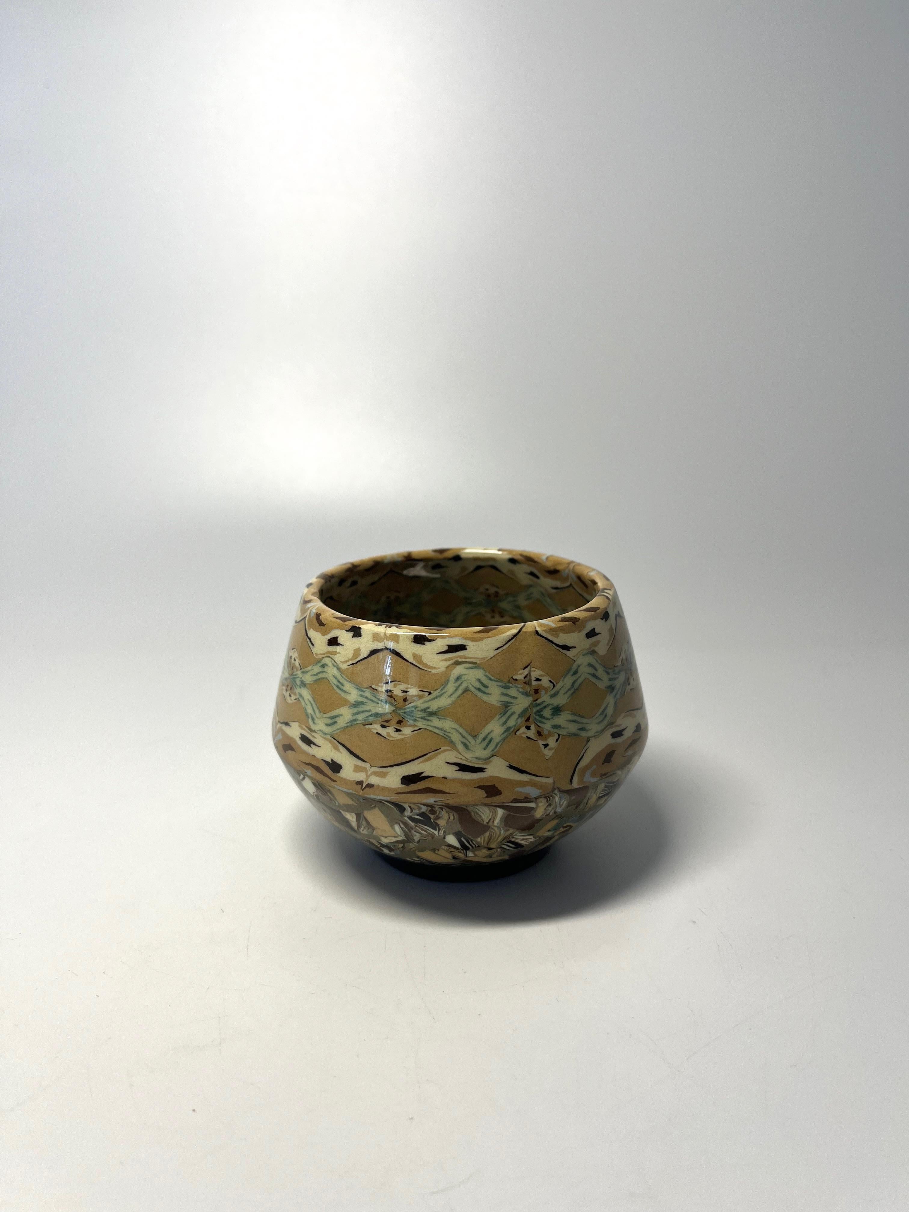 A sweet petit ceramic pot from Jean Gerbino for Vallauris, France.
Beautiful and delicate earth tones mosaic
Circa 1960's
Signed Gerbino  to base
Height 2.5 inch, Diameter 3.5 inch, 
In excellent condition. 
Wear consistent with age and use