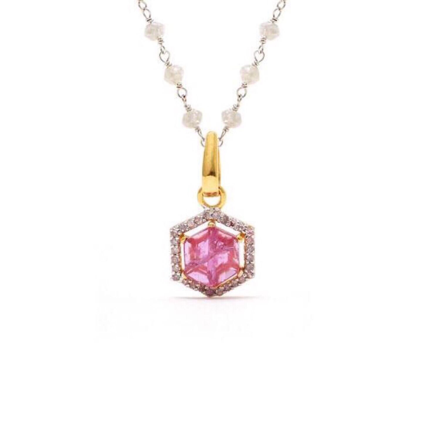 Petit Ruby & Diamond White Diamond Chain Pendant features a fiery natural Mozambique Pink Ruby accented with Brilliant Cut White Diamonds in a handcrafted 18 Garat Gold Pendant.

- Natural Mozambique Pink Ruby set with white diamonds.
- Set with 18
