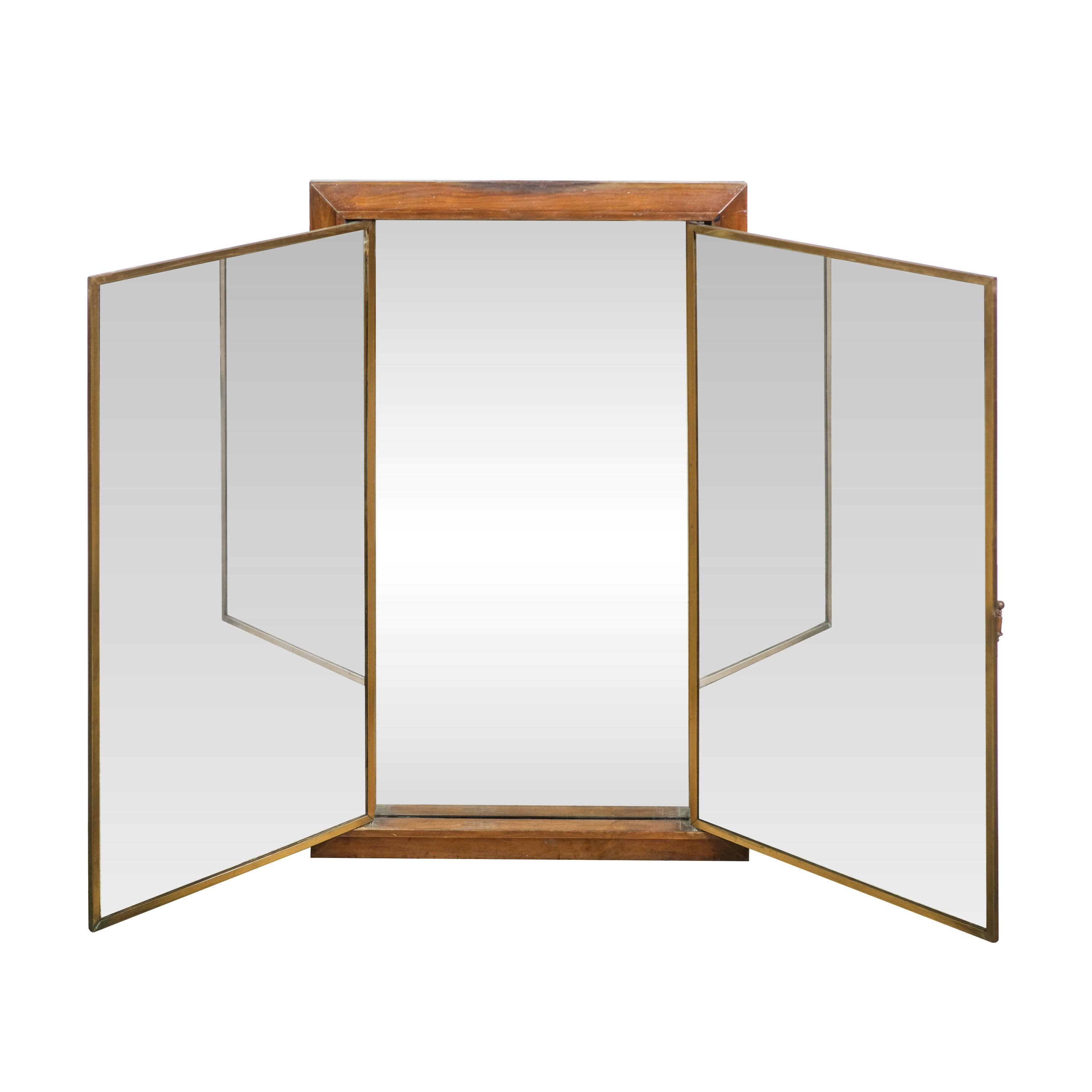 20th century three way three foot tall folding mirror. The wood frame has not been refinished and has the original patina. Original distressed beveled mirrors. Also features bronze details. Made by Miroir Brot Paris. Please see images. This can be