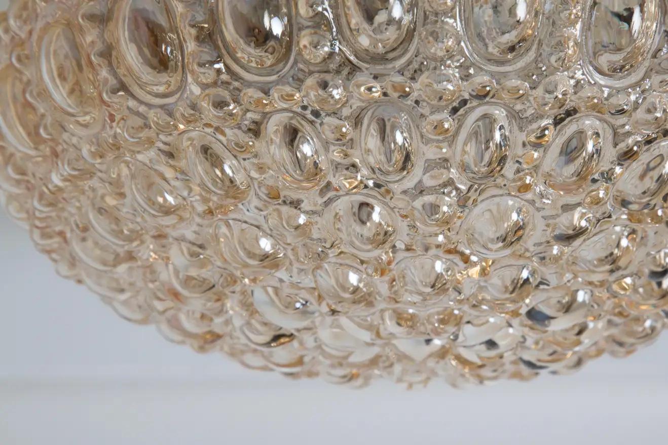 Petite 1960s Helena Tynell Bubble Glass Flush Mount for Limburg. Executed in thick and heavy textured bubble glass with brass finished metal mounting structure. Can be used as a wall lamp or flush mount. Produced in Limburg, Germany circa the