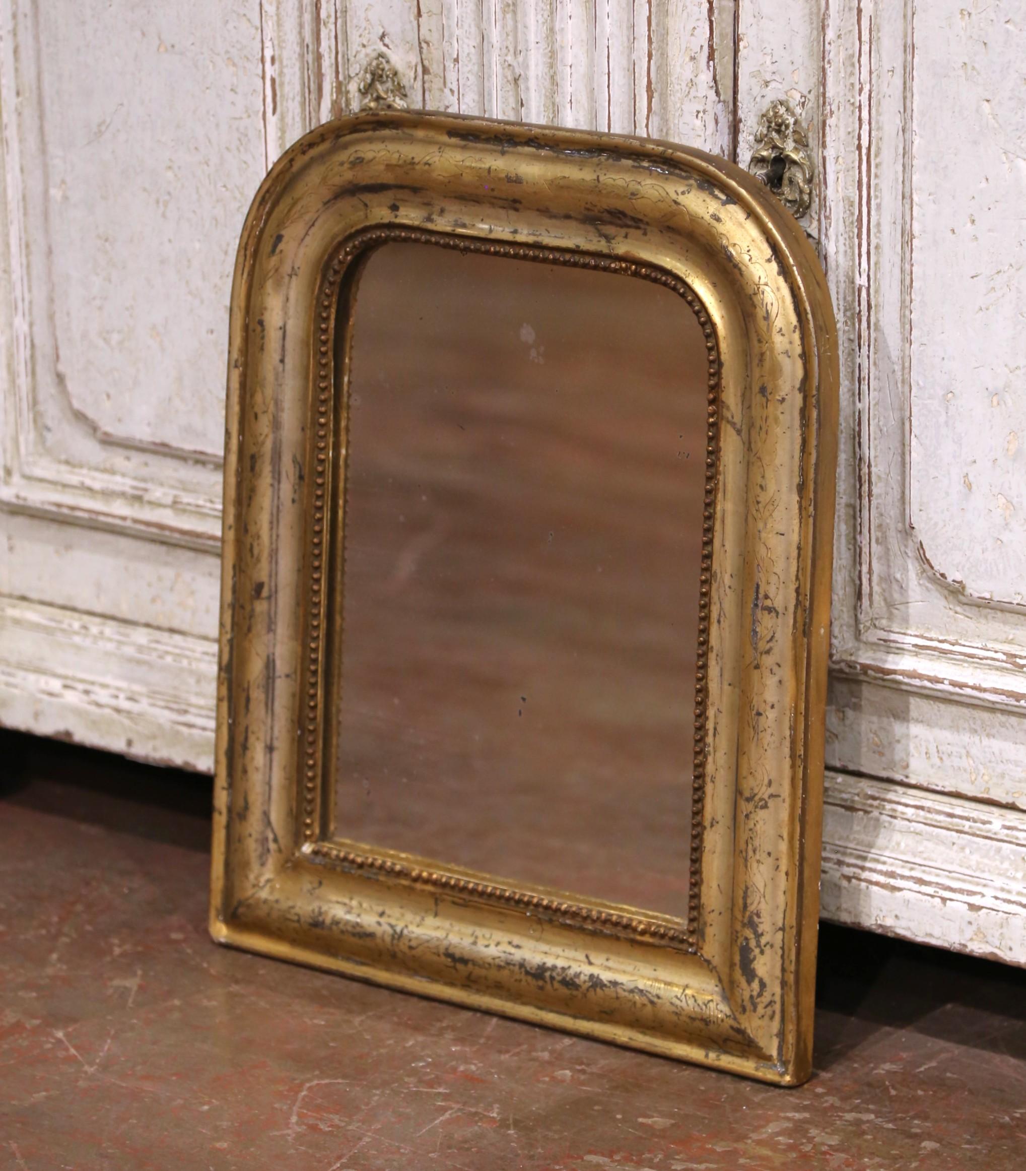 Bring refined antique character to your space with this charming French mirror. Crafted circa 1870, the piece measures 15.5 inches wide by 19 inches high and features the classic rounded top and clean, understated silhouette typical of the Louis