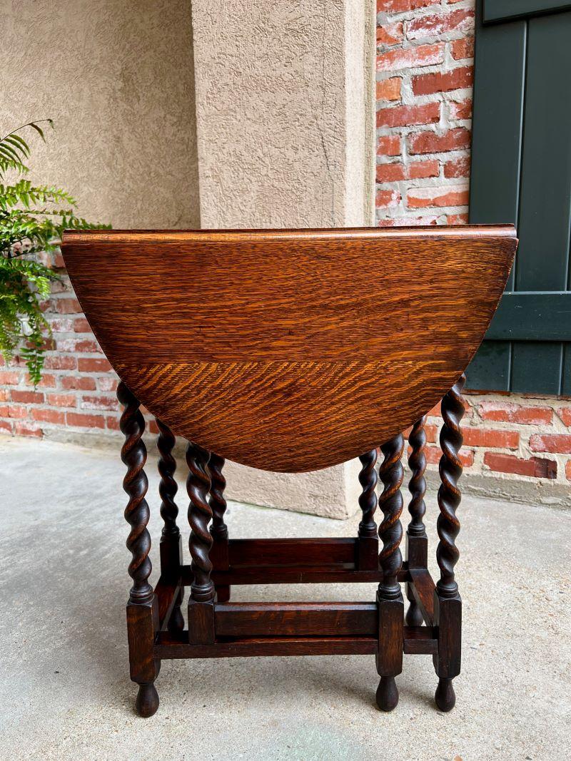 Petite Antique English oak drop leaf side sofa table barley twist gate leg

Direct from England, a beautiful antique English oak gate leg, drop leaf table with British barley twist legs.
It is a very petite size, which is the smallest size drop leaf