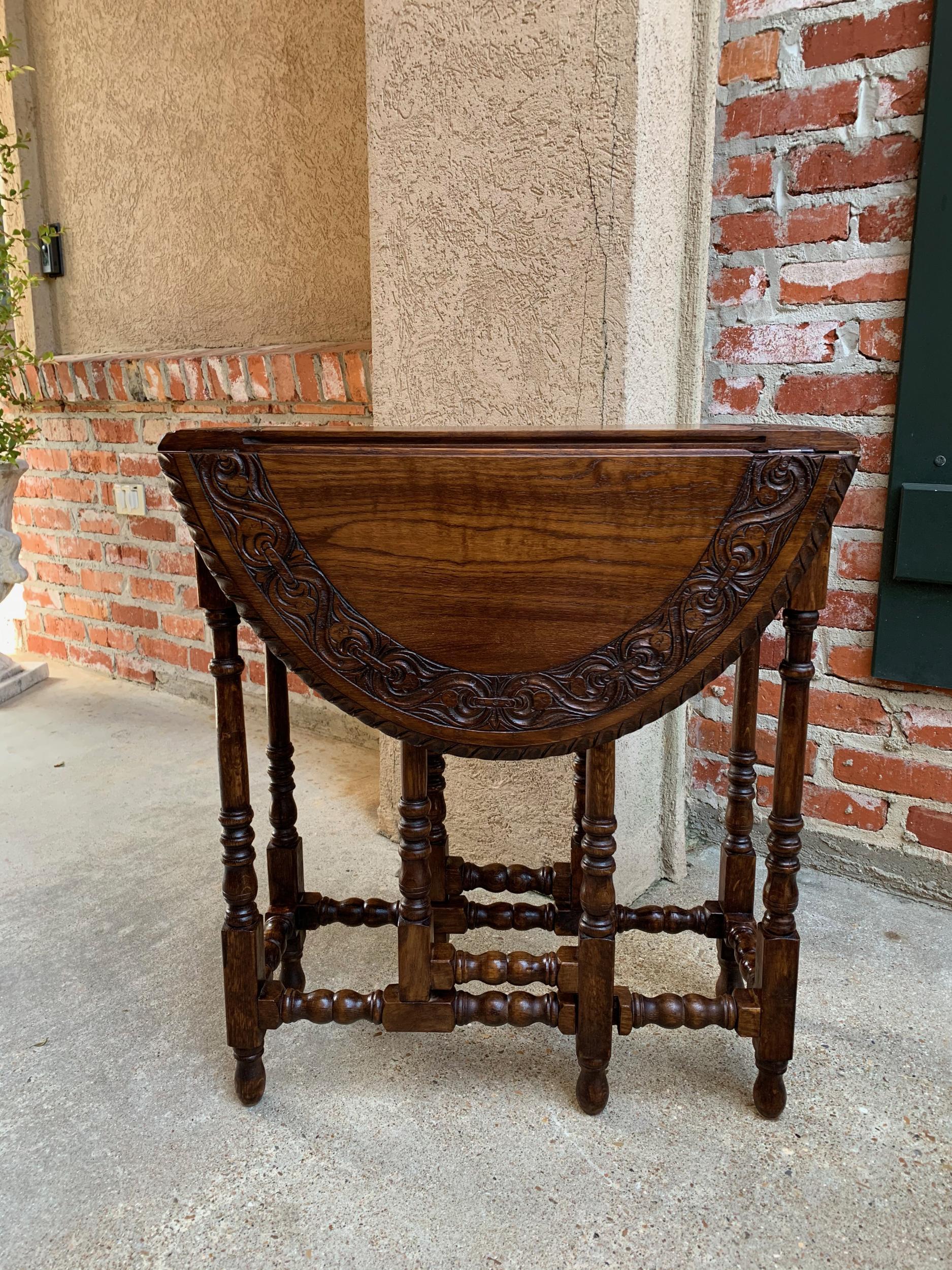 Petite antique English oak side sofa wine table drop-leaf gate leg carved oval
 
~Direct from England~
~A beautiful antique English oak gate leg, drop-leaf table. It is a very petite size, which is the smallest size drop leaf table available (and