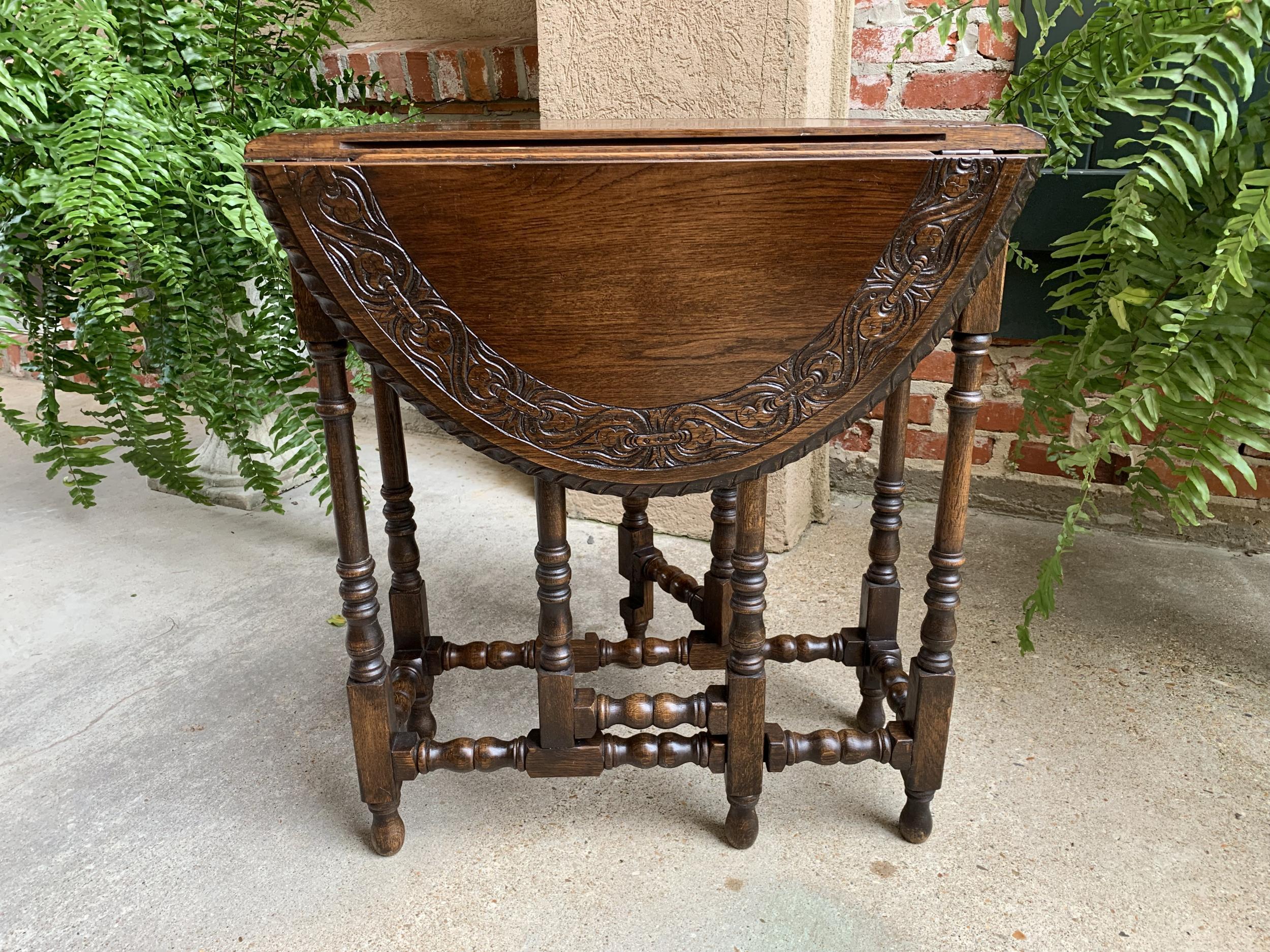 Petite antique English oak side sofa wine table drop leaf gate leg carved oval
 
~Direct from England~
~A beautiful antique English oak gate leg, drop leaf table. It is a very petite size, which is the smallest size drop leaf table available (and