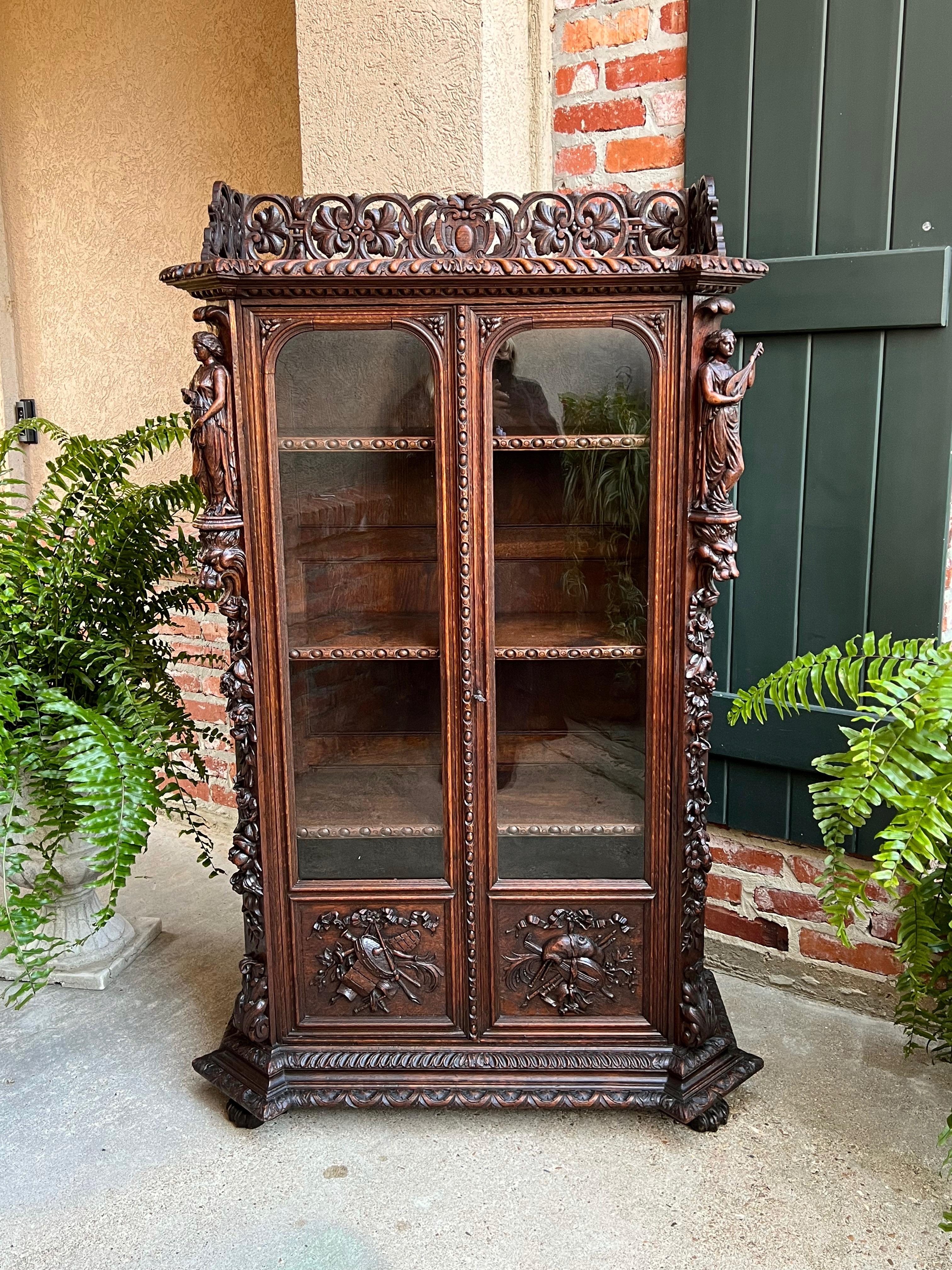 Petite antique French carved oak Renaissance revival bookcase cabinet music

~Direct from France~
Exquisitely hand carved 19th century French bookcase, in a versatile and unique, petite size.
Note: I believe this cabinet was handmade for French