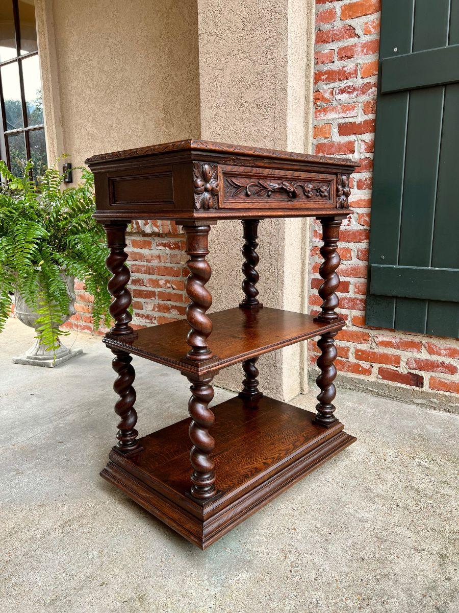 Petite Antique French carved oak server sideboard barley twist display shelf.

Direct from France, this special petite size 19th century French dessert server/sideboard or display cabinet. The unique, super petite size makes this extremely versatile