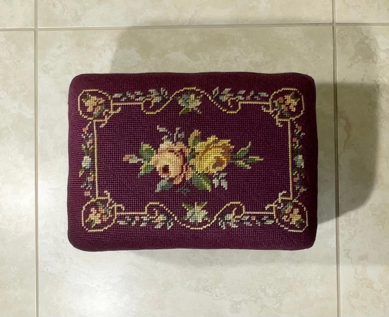 Petite Elegant foot stool made hand carved woof wood, upholstered with beautiful floral motif needlepoint textile.
Great decorative object of art for any room.