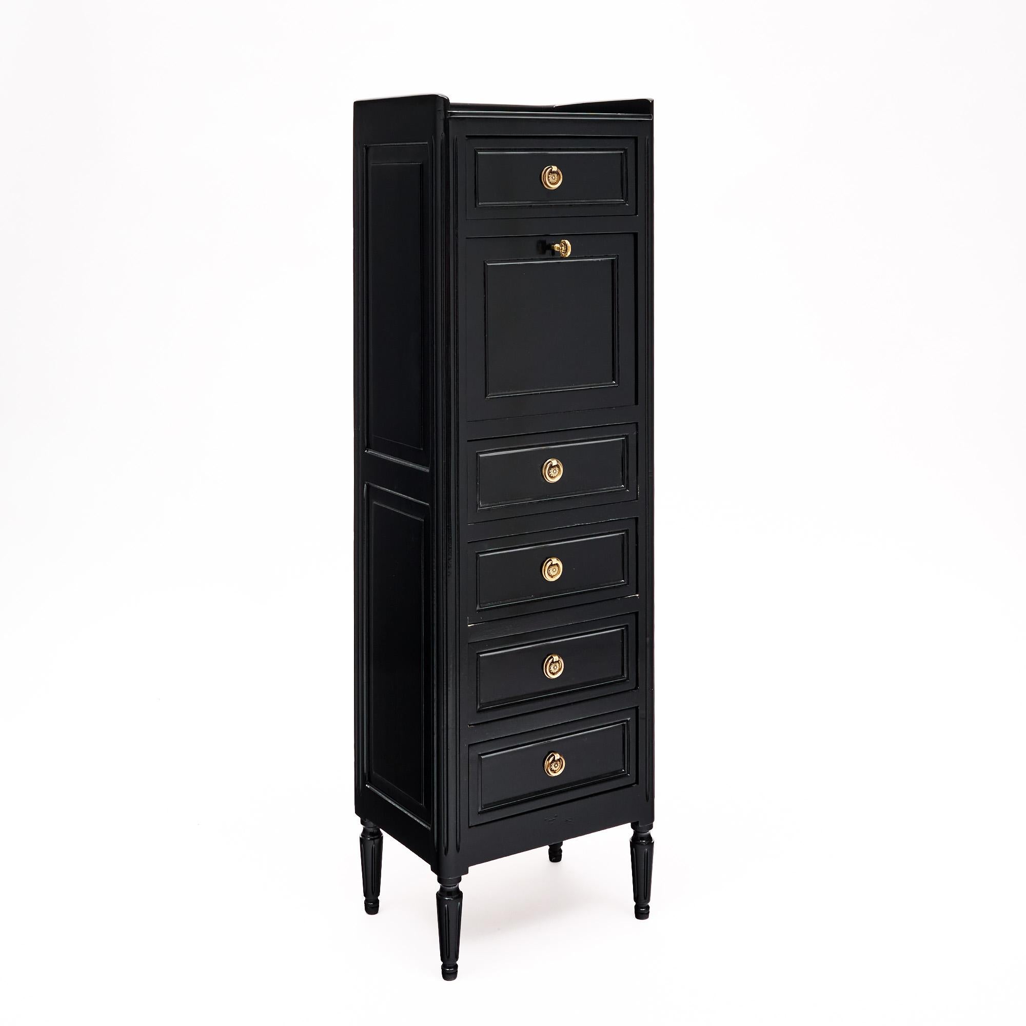 French antique secretaire in the Louis XVI style. This piece is made of solid wood construction, primarily mahogany that has been fully ebonized and finished with a lustrous French polish of museum-quality. There are five dovetailed drawers and one