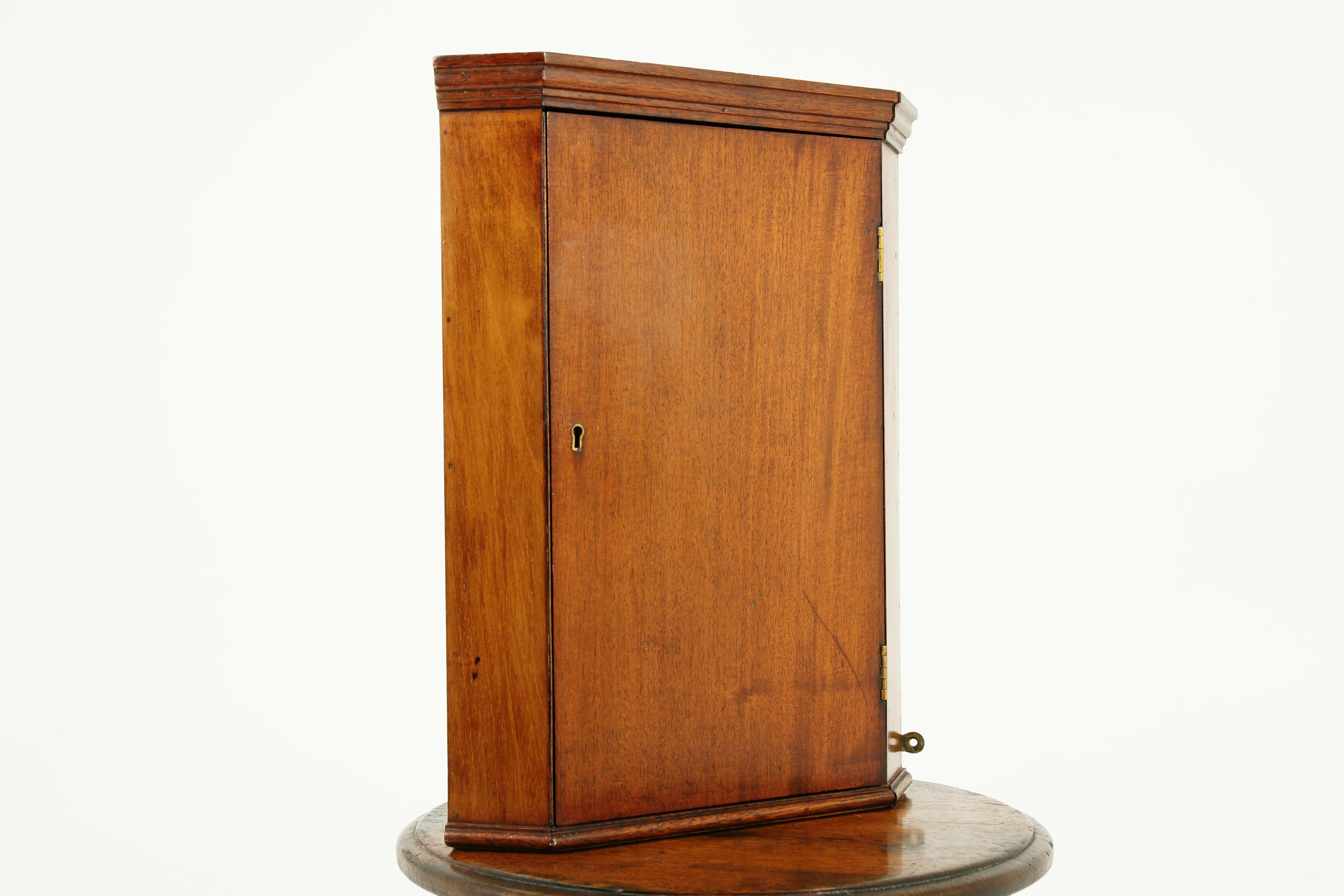 Petite antique mahogany hanging corner cabinet, Scotland 1910, B2391

Scotland 1910
Solid mahogany
Original finish
Moulded cornice on top
Single door to the front
Original lock no key
Inside a single fixed shelf
All standing on a moulded