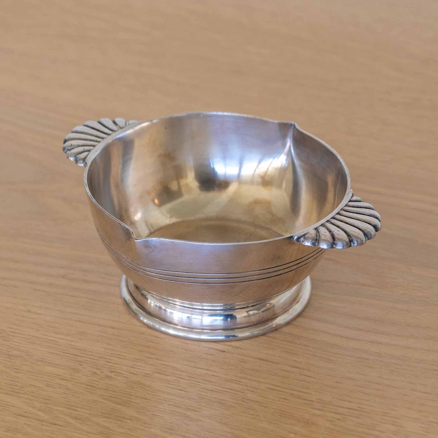 Beautiful Art Deco silver plated bowl from France, 1930's. Petite bowl with grooves around edge and lovely shell  detail on handles. Original finish shows great age and patina. Perfect as a decorative object or catchall. Stamped on underside. 