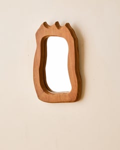 Petit miroir en bois fait par un artisan
