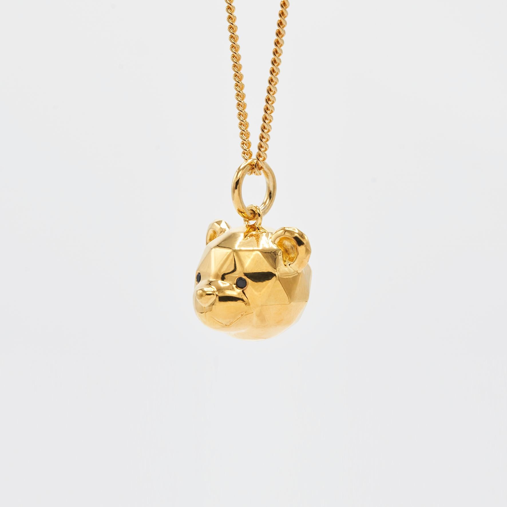 Fun cut bear pendant from our NOT A TOY collection.

Dimensions:
13mm x 11mm, chain 45cm + 5cm extender            
Composition: 
Sterling Silver 24k gold plated / cubic zirconia
Sold with chain