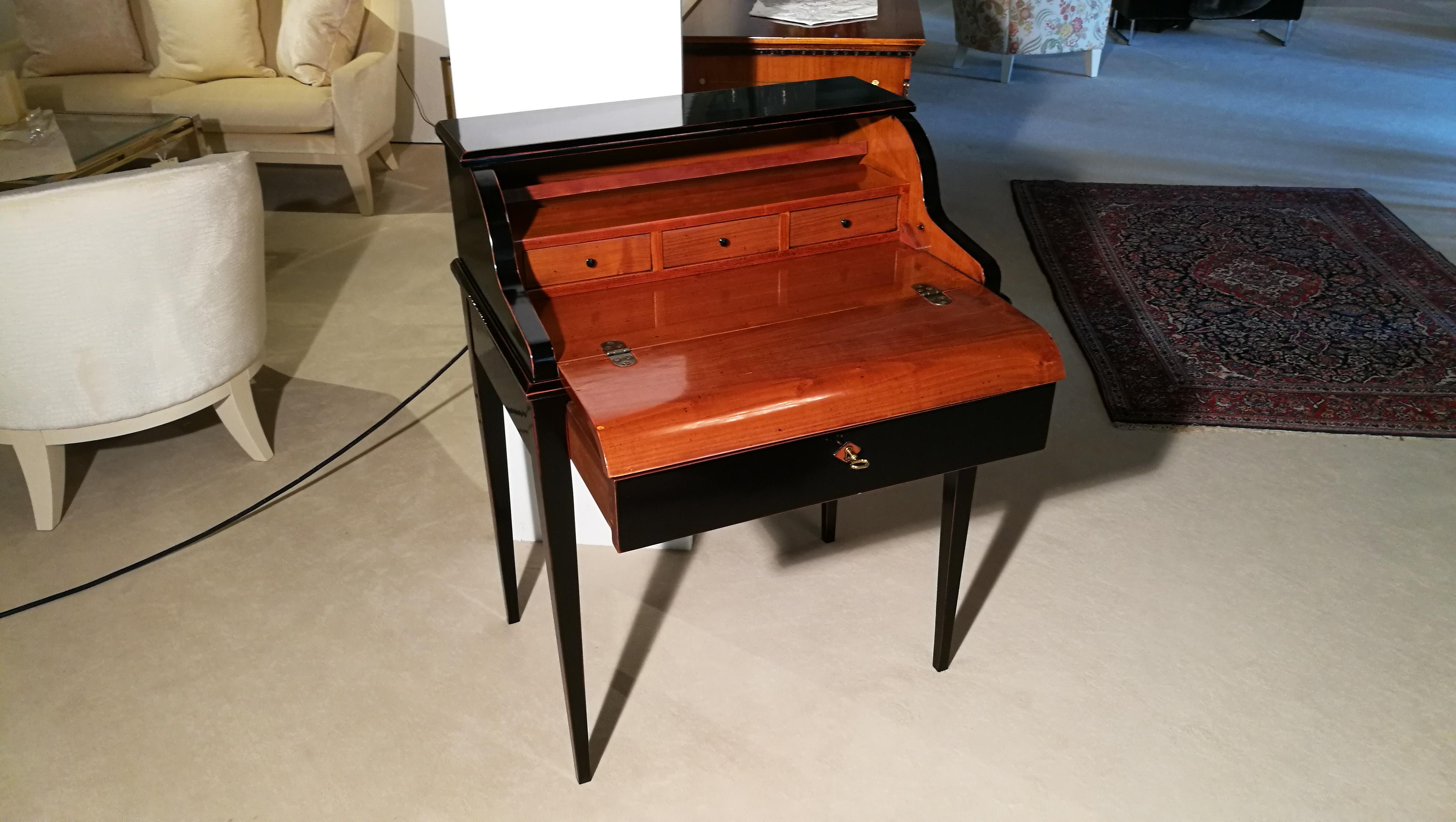 Here you have an outstanding secretary in the style of Biedermeier. It was handmade of cherrywood in Germany. With many details and much complex work. The below drawer opens automatically, when you open the cover. The exterior is finished with high