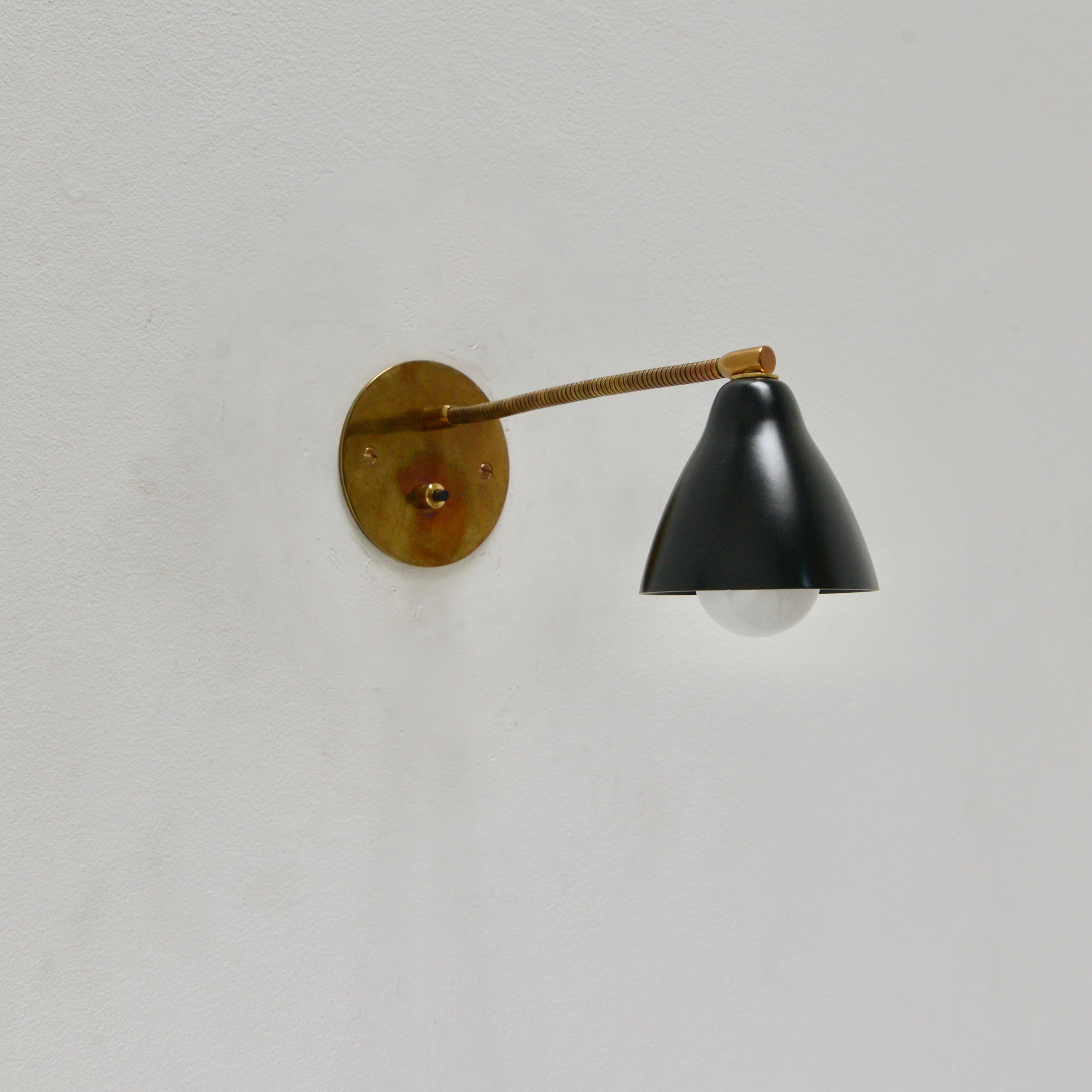 Pair of petite 1950s Italian gooseneck sconces. Partially restored, original brass finish. (1) E12 candelabra based socket per sconce. Priced as a pair. Wired for use in the US. Lightbulbs included with order.
Measurements:
Height 5”
Depth