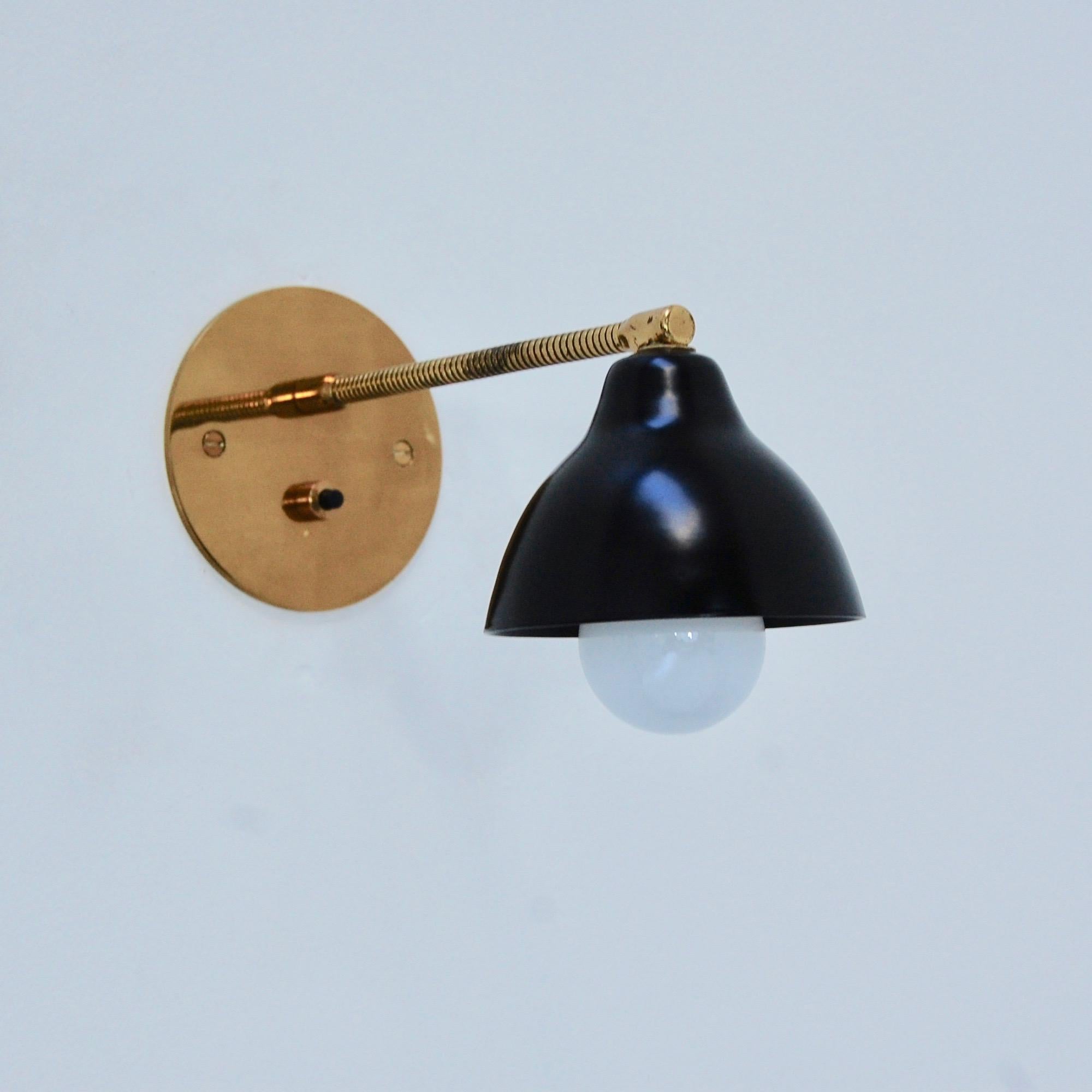 Pair of Mid-Century Modern petite Italian gooseneck sconce reading lights from Italy. Partially restored, patina lacquered brass, and black powder-coated aluminum. Single E12 based socket per sconce. Maximum wattage 60 watts per sconce. Back plate