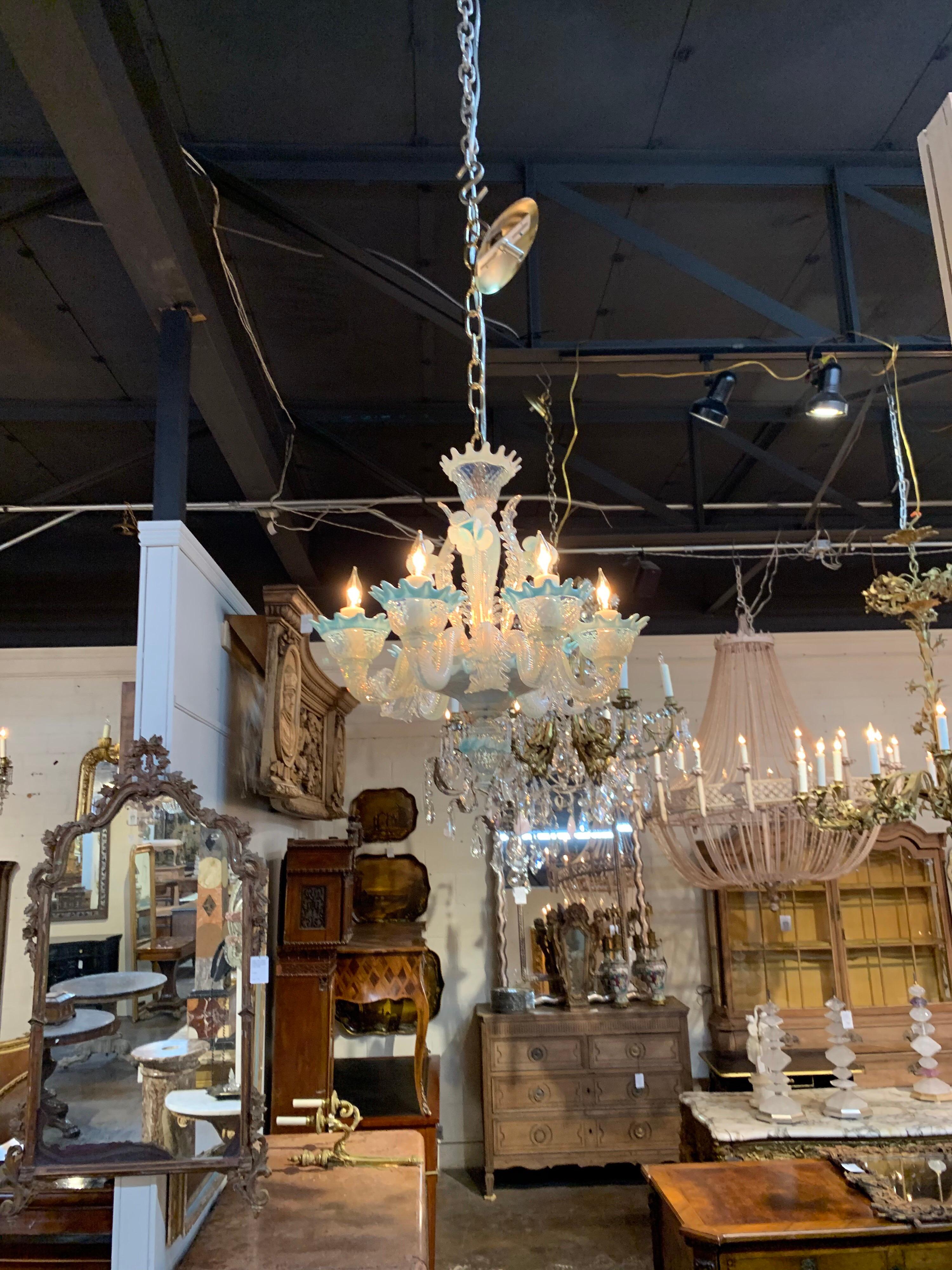 Adorable petite blue Murano glass chandelier. The chandelier has clear, milky white and pale blue glass and an array of leaves and flowers. Note the small size. Very rare and hard to find. So pretty!