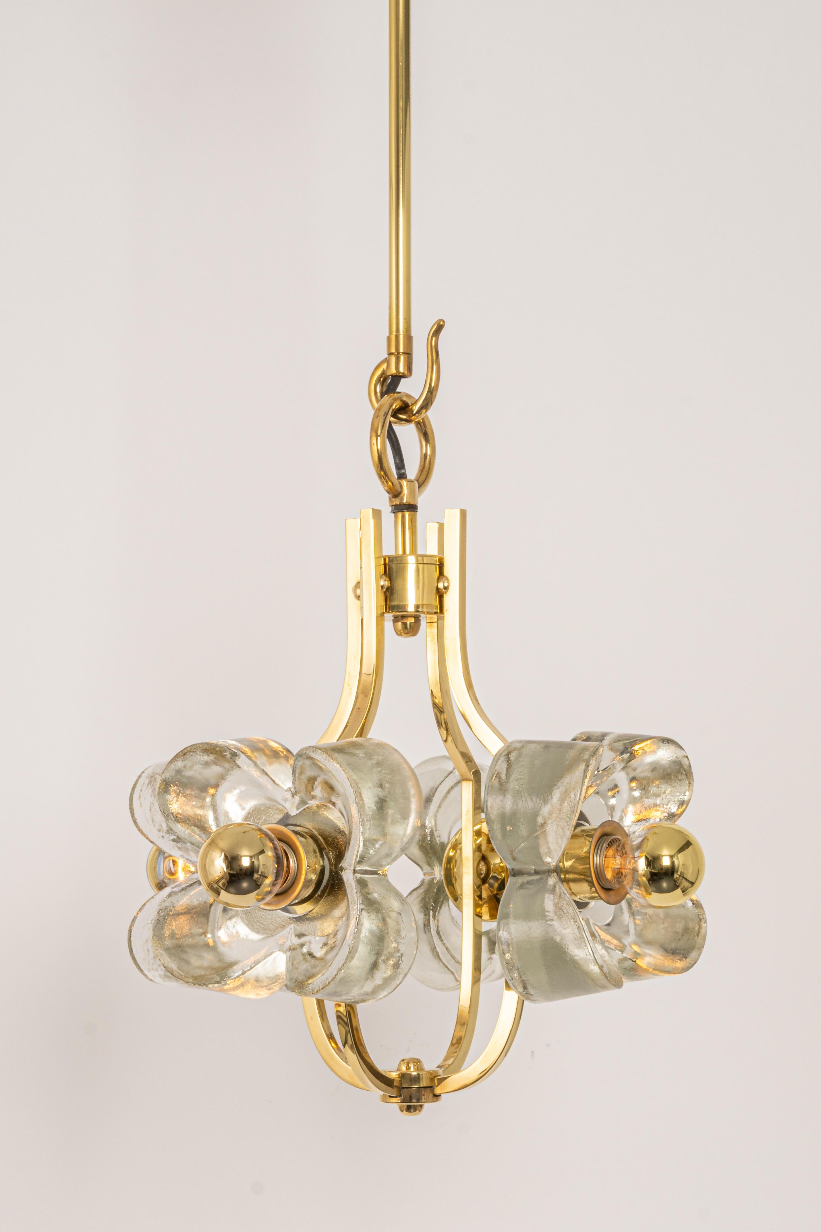 A wonderful petite and high-quality gilded chandelier/pendant light fixture by Sische, Germany, 1970s

It is made of a brass frame decorated with 4 crystal glasses.
The lamp takes 4 small base bulbs (max. 40W per bulb).
Light bulbs are not