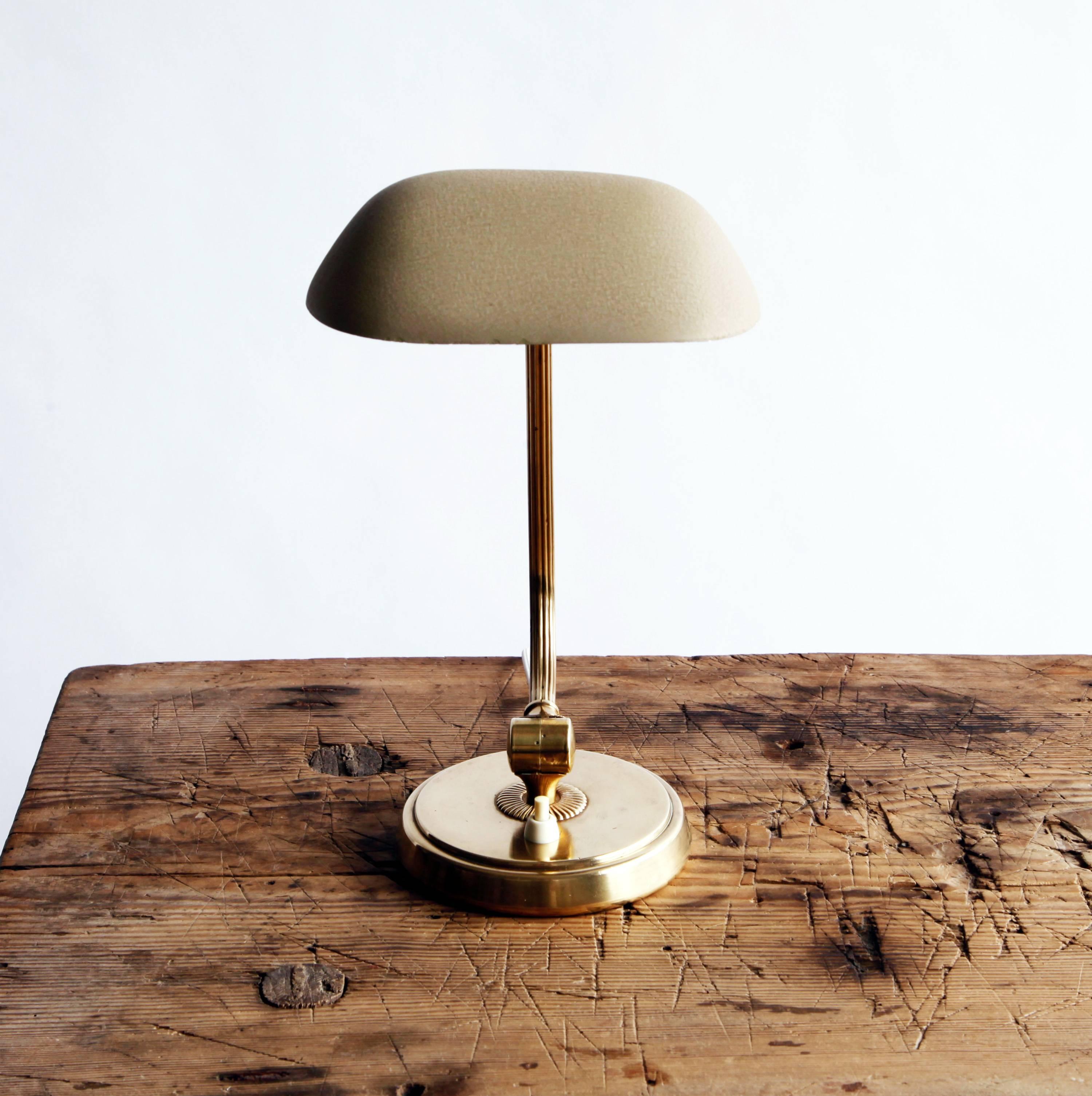 A bit of jewelry for the desk top. This small, graceful lamp with adjustable shade was made for renowned Swedish department store NK. 

Rewired for U.S.